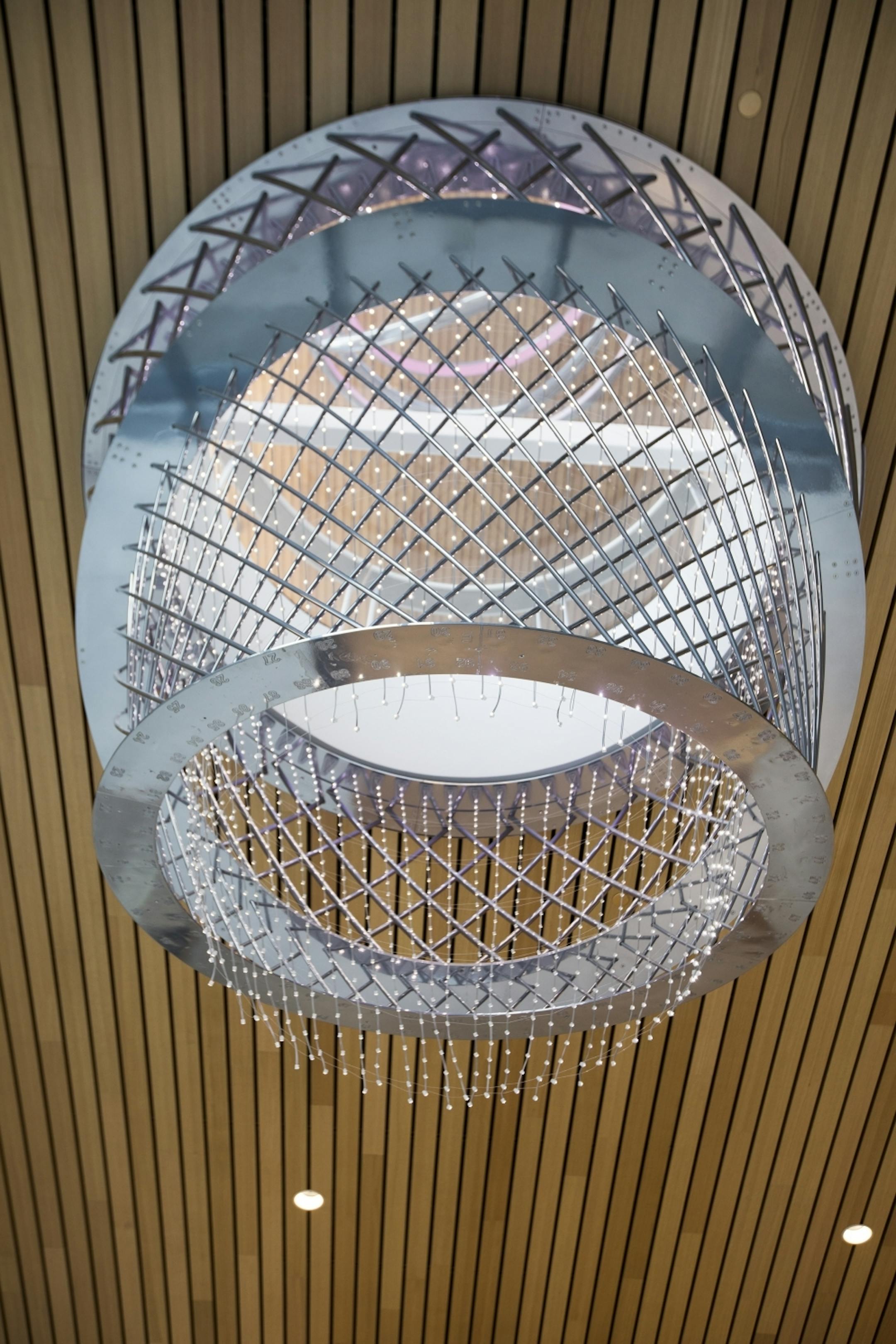 A chandelier shaped like a basketball hoop in the main lobby.