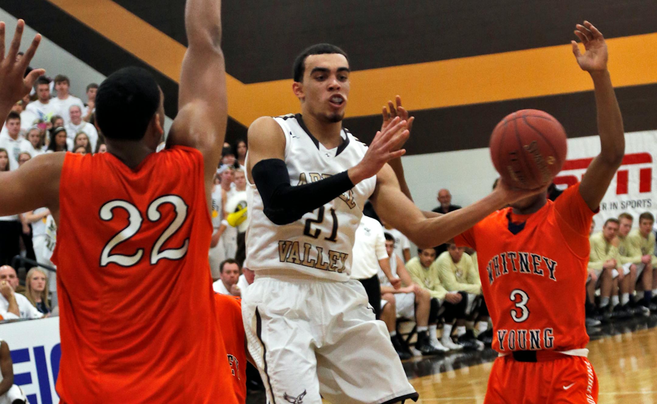 Whitney Young's Jahlil Okafor (22) stopped Apple Valley's Tyus Jones (21) from driving to the basket.