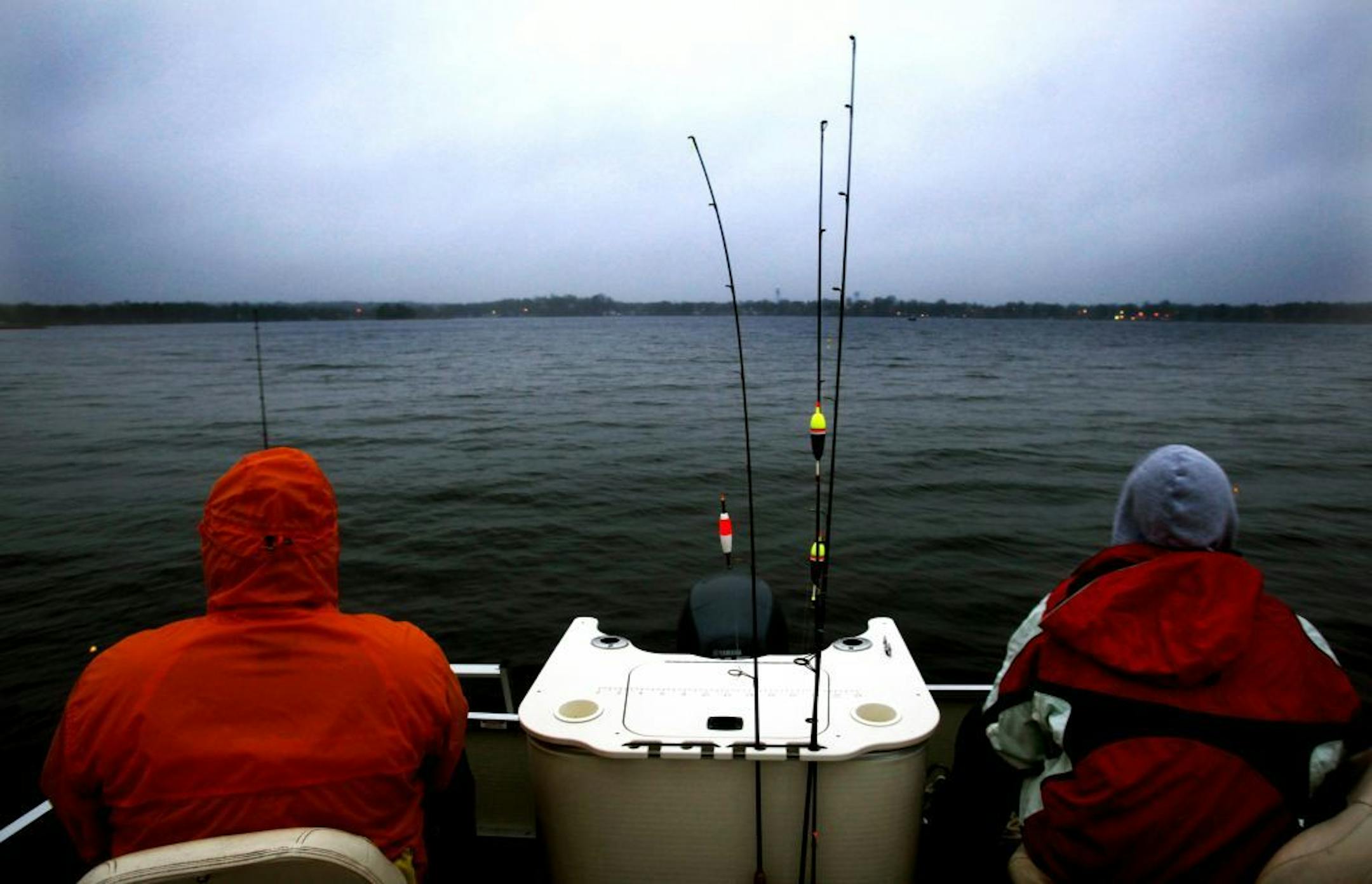 At 5:30 AM, with the temperatures in the high 30's and winds gusts of 10 miles per hours on Mille Lacs Lake, few boats dotted the landscape in Isle Bay. (L to R) Brian Moehnke of Rochester, MN and his cousin Scott Moehnke of Shakopee, MN braved the cold weather in Isle Bay to attempt to catch walleys in 6 feet of water.