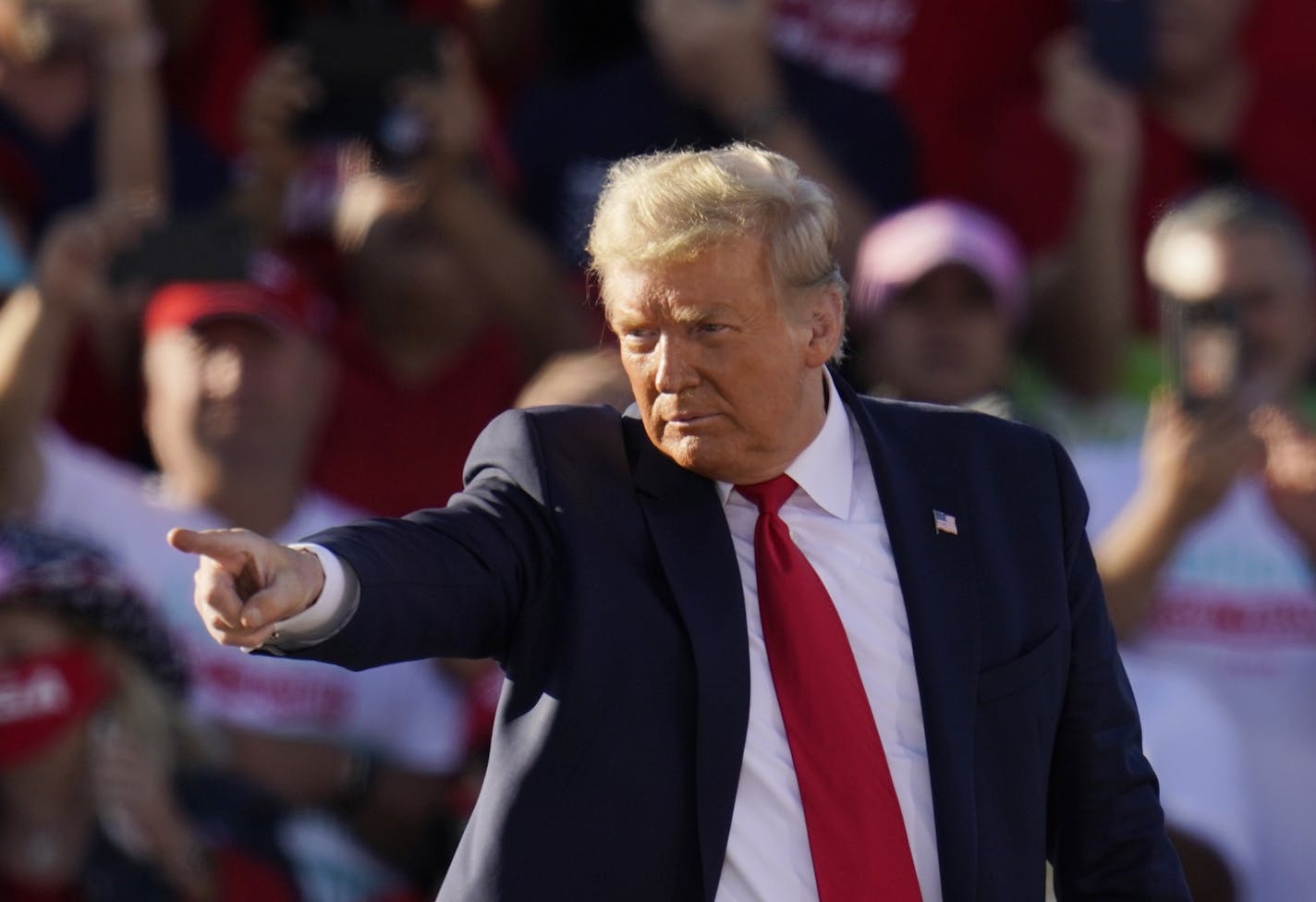 President Donald Trump points to the crowd after speaking at a campaign rally at Phoenix Goodyear Airport Wednesday, Oct. 28, 2020, in Goodyear, Ariz. (AP Photo/Ross D. Franklin)