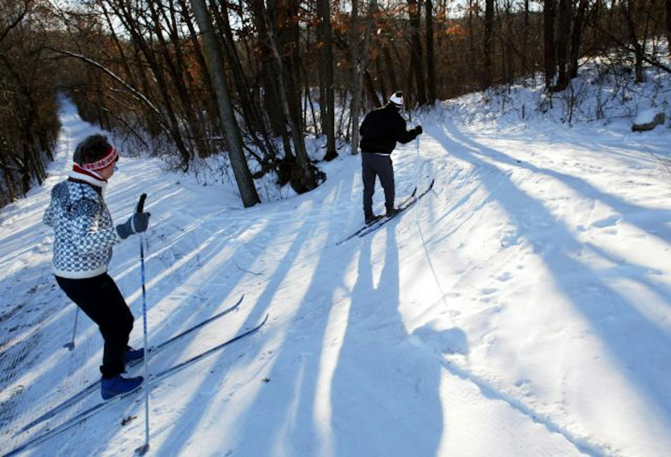 Cindy Nelson and her husband Nick, both formally of Eagan, cross country ski at Lebanon Hills Park in Eagan Friday afternoon as they visit their daughter for the holidays. The Nelsons now live in Loveland, Colorado, but used to live near the trails when they resided in Eagan. Stribsouth 12/20/03? (Fri is 19th, Sat the 20th) -- See article on Sports page S8 in the Wed Dec 24, 2003, Star Tribune South, about skiing in Lebanon Hills Regional Park.