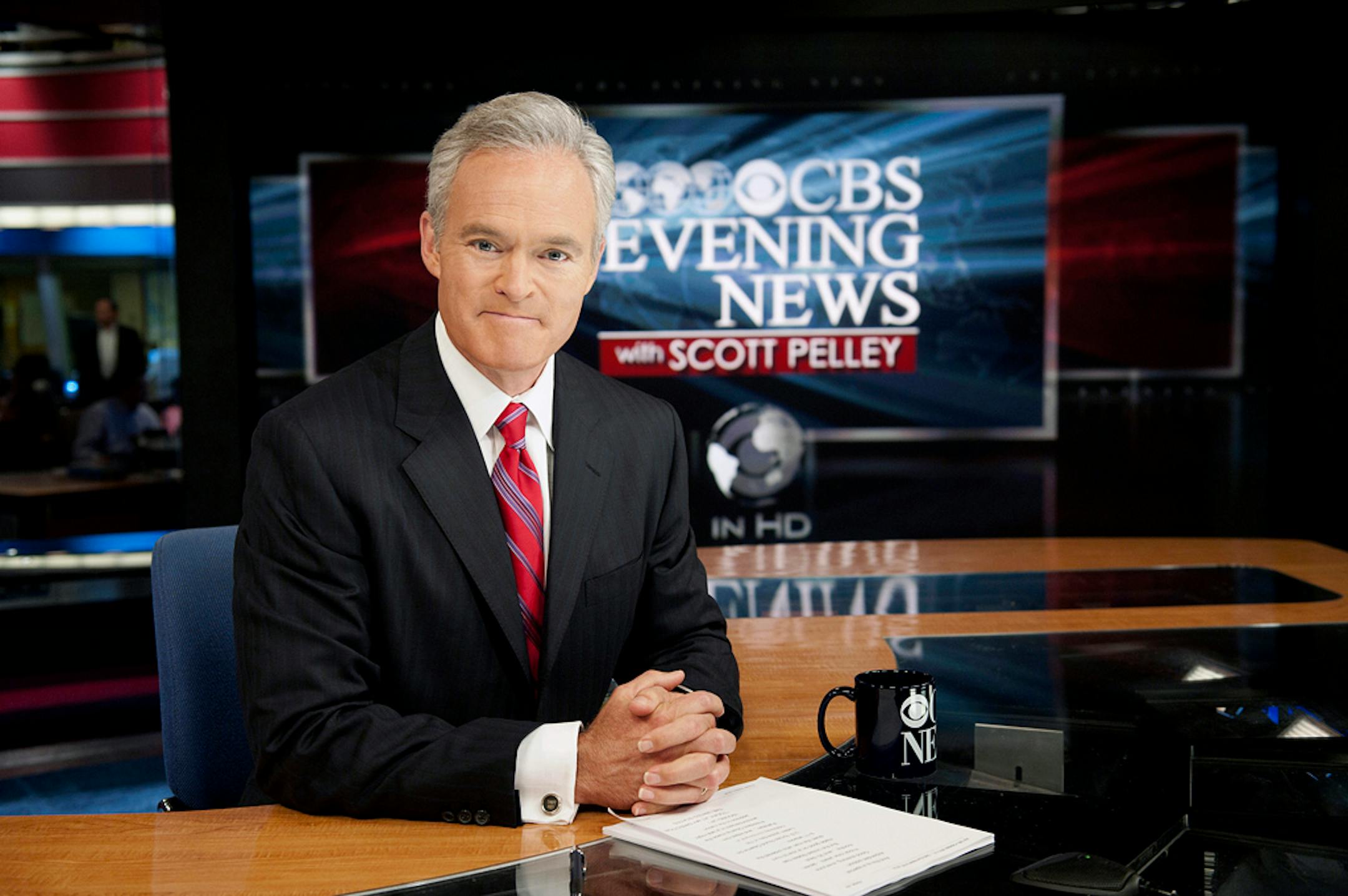 FILE - This undated file photo released by CBS shows "CBS Evening News" anchor Scott Pelley. Pelley marks one year on the job Wednesday as anchor of the "CBS Evening News." And he's already got his eye on the top of the mountain. Pelley says he's confident his broadcast will get to No. 1 in the ratings. That would be a big achievement at CBS, where the newscast has been third behind NBC and ABC since the late 1990s, through anchors Dan Rather, Bob Schieffer, Katie Couric and now Pelley. (AP Phot
