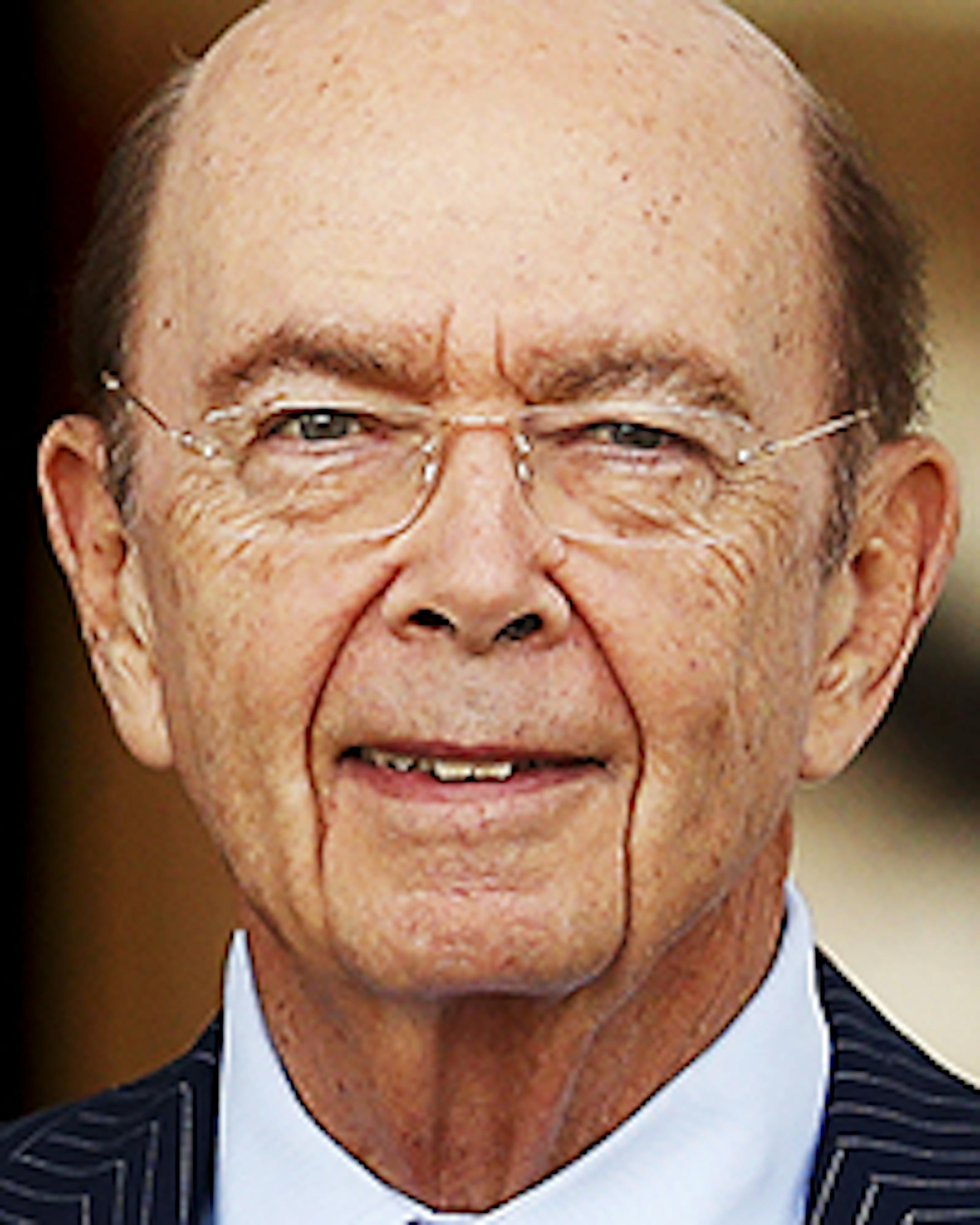 President-elect Donald Trump pauses for photographs with investor Wilbur Ross as he leaves the Trump National Golf Club Bedminster clubhouse, Sunday, Nov. 20, 2016, in Bedminster, N.J.. (AP Photo/Carolyn Kaster)