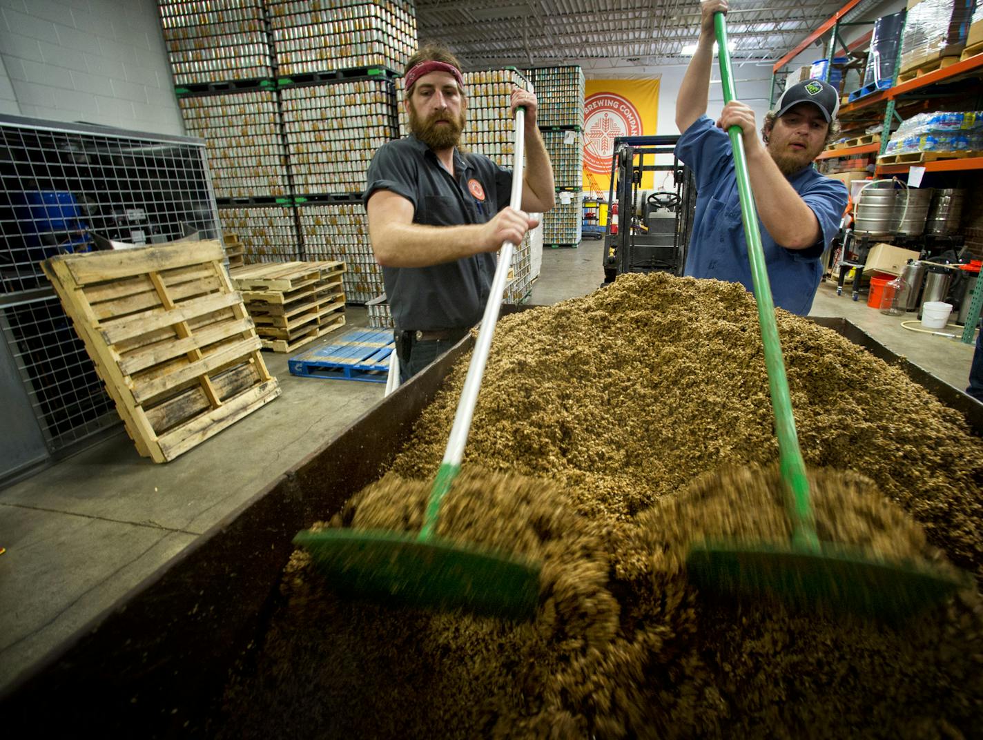 Chad Hilgenberg, brewer and Josh Bischoff, head brewer at Indeed Brewing Company, Minneapolis removed spent malt from a brewing tank. The beer business is booming in Minnesota, and it was the state Legislature that opened the taps. Since lawmakers allowed brewers to open taprooms on their premises, Minnesota has enjoyed the nation's second-highest growth of craft brewing. Tuesday, June 25, 2013. ] GLEN STUBBE * gstubbe@startribune.com