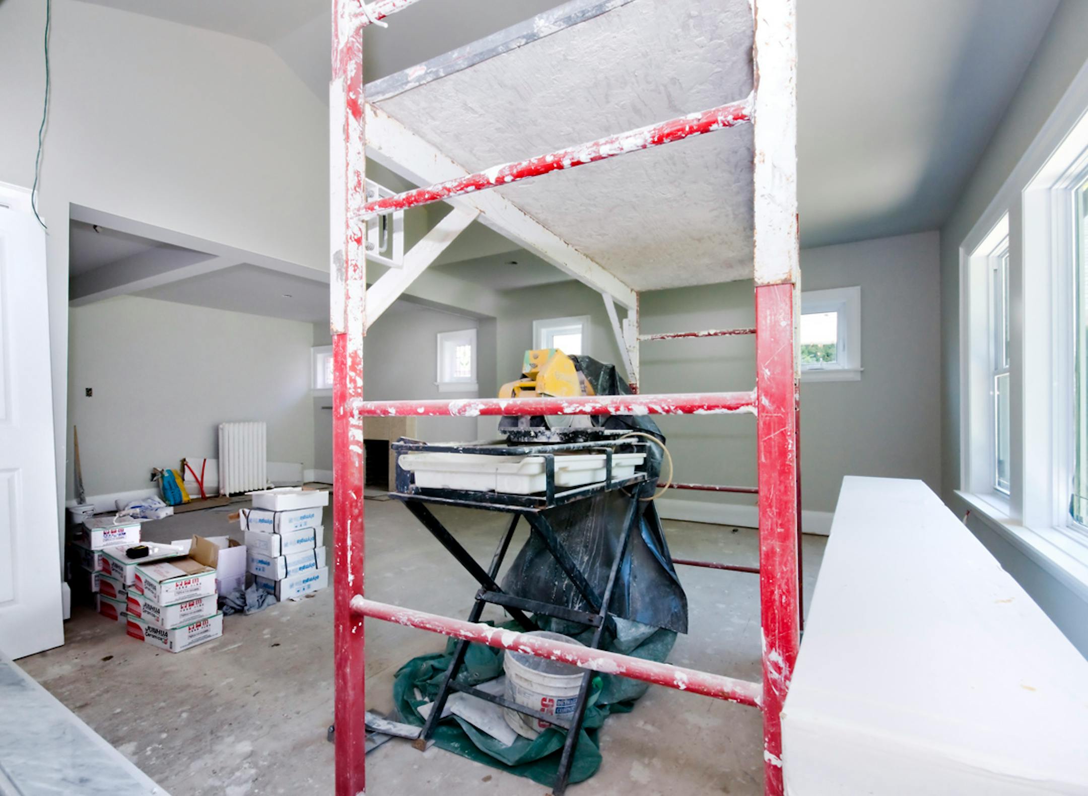 Before Freshly dry-walled, the room was a perfect size for a master suite and already had a spacious walk-in closet, stained-glass windows and an inoperative fireplace.