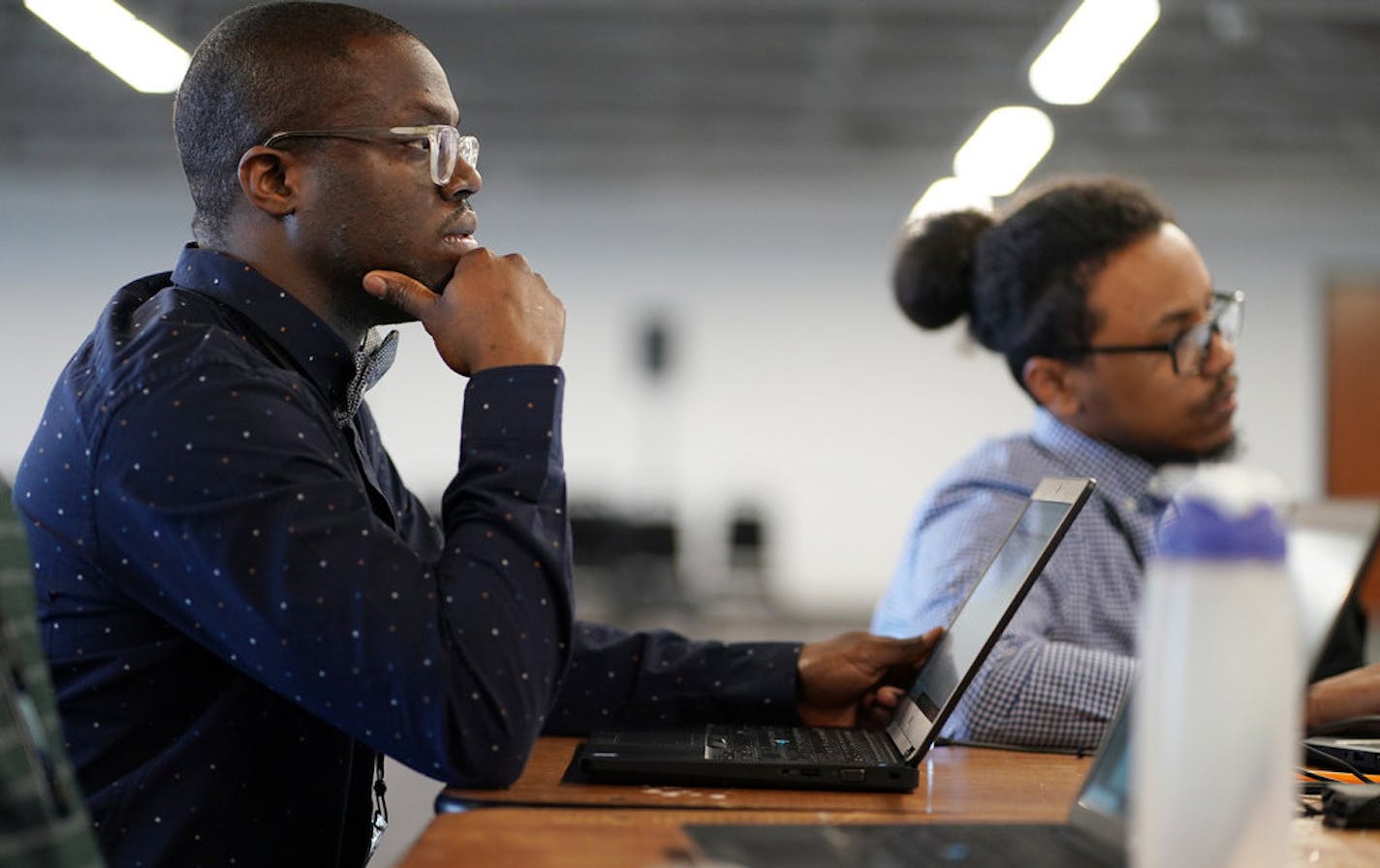 Gonkama Johnson, a gradutate of Summit Academy's IT training program, has landed a job at partner-employer Atomic Data. Photo: Anthony.Souffle@startribune.com