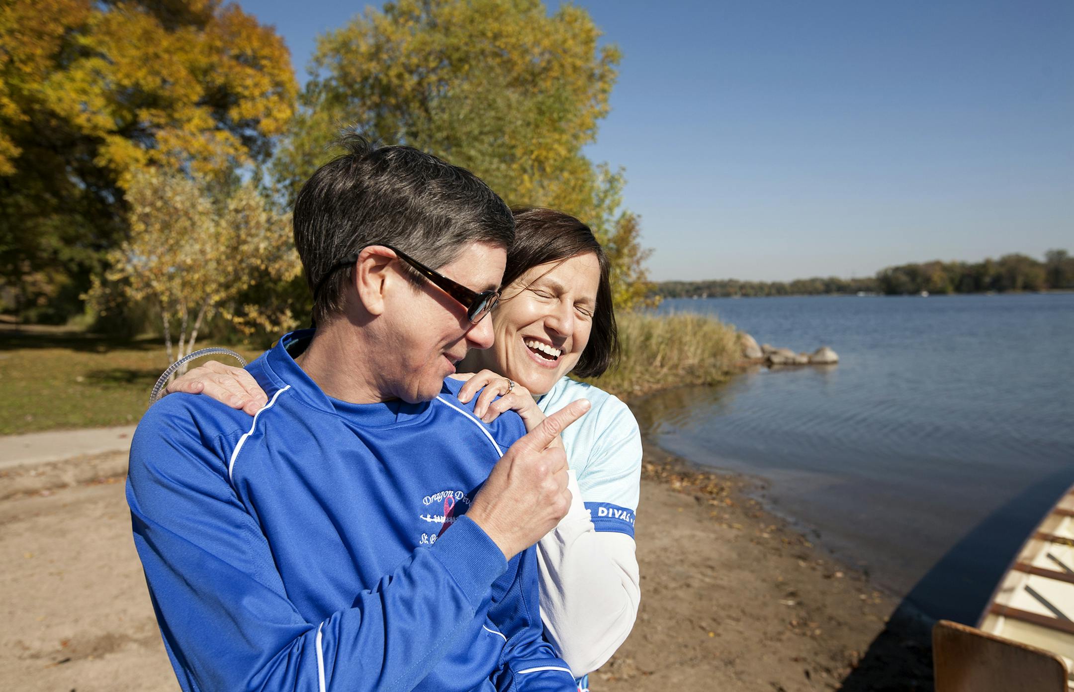 Dr. Judith Trudel, left, recalls how years ago Dr. Sandra Rosenberg, right, jokingly forced her to join the Dragon Divas. The paddlers trained on Lake Gervais in Little Canada October 11, 2014. (Courtney Perry/Special to the Star Tribune)