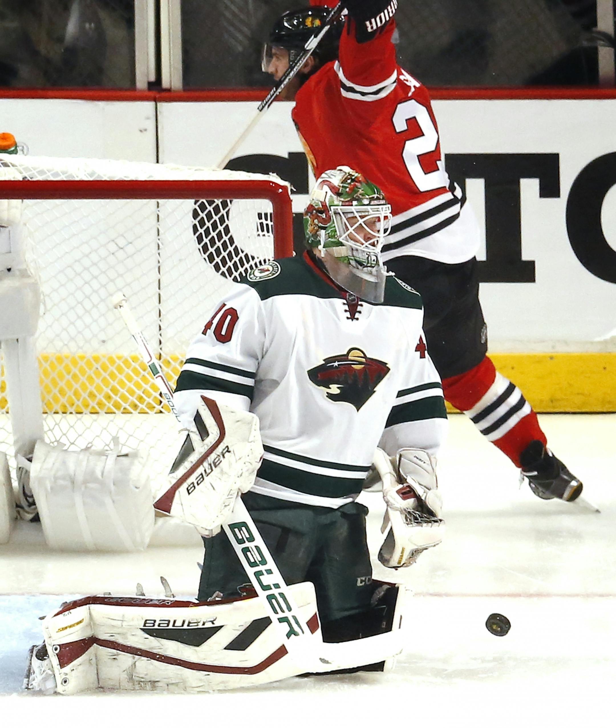 Brandon Saad (20) celebrated after getting the puck past Wild goalie Devan Dubnyk (40) for a goal in the first period.