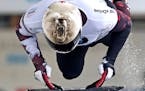 Barrett Martineau of Canada jumps on the skeleton during the men's race at the Skeleton World Cup in Altenberg, eastern Germany, Saturday, Nov. 28, 20
