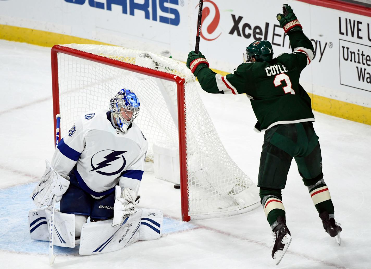 Tampa Bay goaltender Andrei Vasilevskiy watches as Wild center Charlie Coyle celebrates the game-winning goal by Mikael Granlund on Saturday.