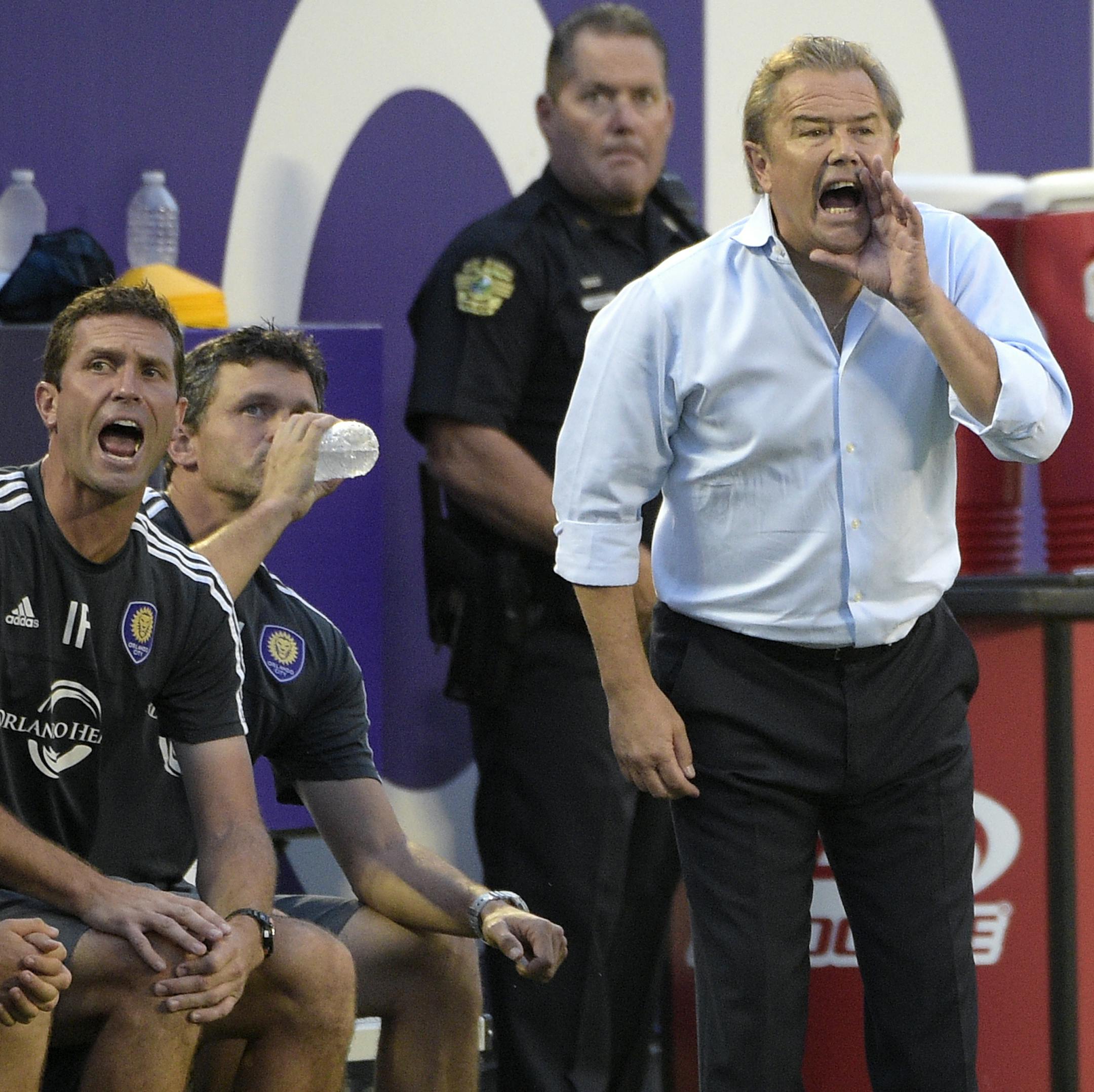 Orlando City head coach Adrian Heath, right, calls out instructions from the sideline during the first half of an MLS soccer match against the Columbus Crew in Orlando, Fla., Saturday, Aug. 1, 2015. (AP Photo/Phelan M. Ebenhack) ORG XMIT: OTKCREW202