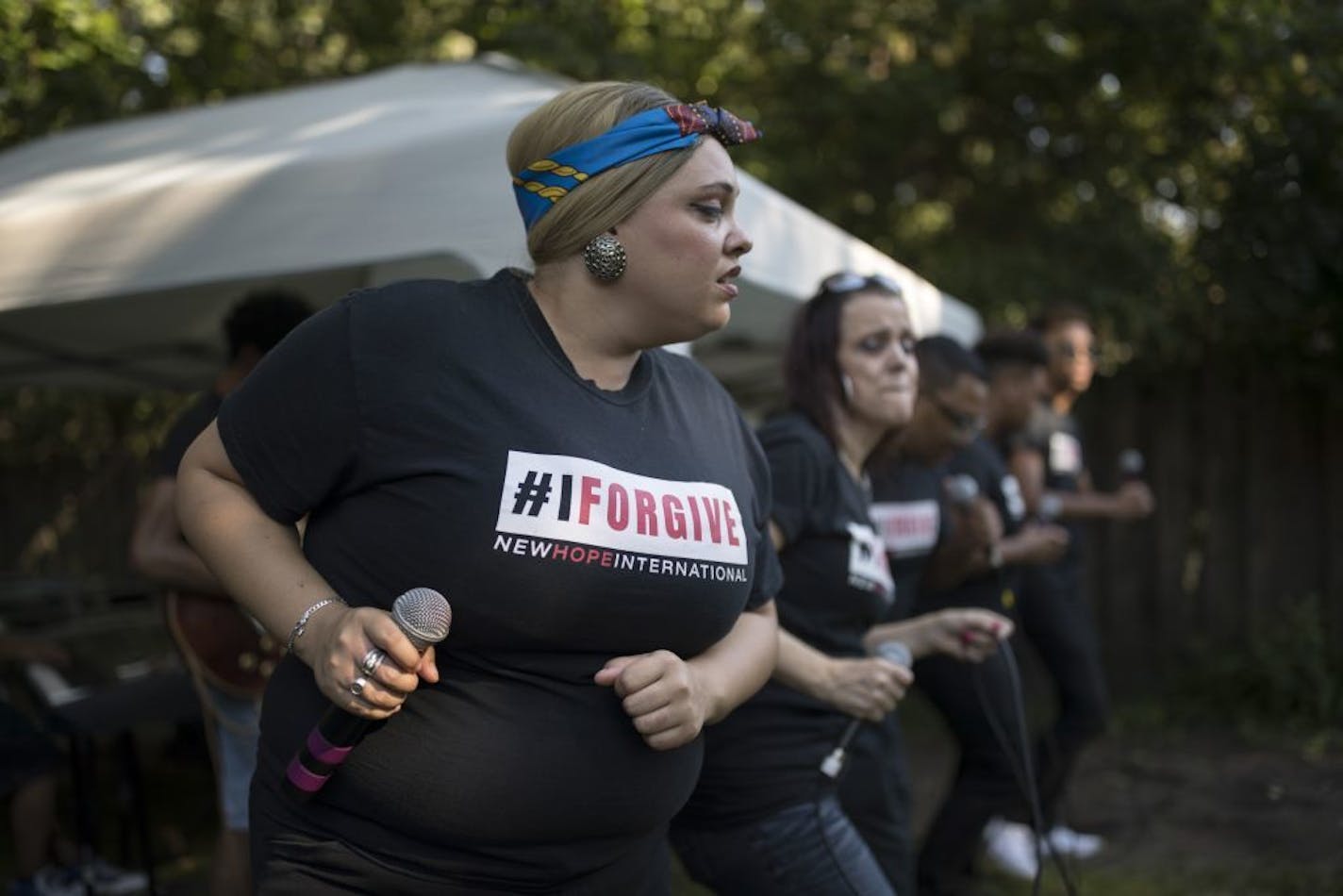 Lauren Hertzenberg and members of the South African gospel choir 29:11 sang at a private home in Bloomington.