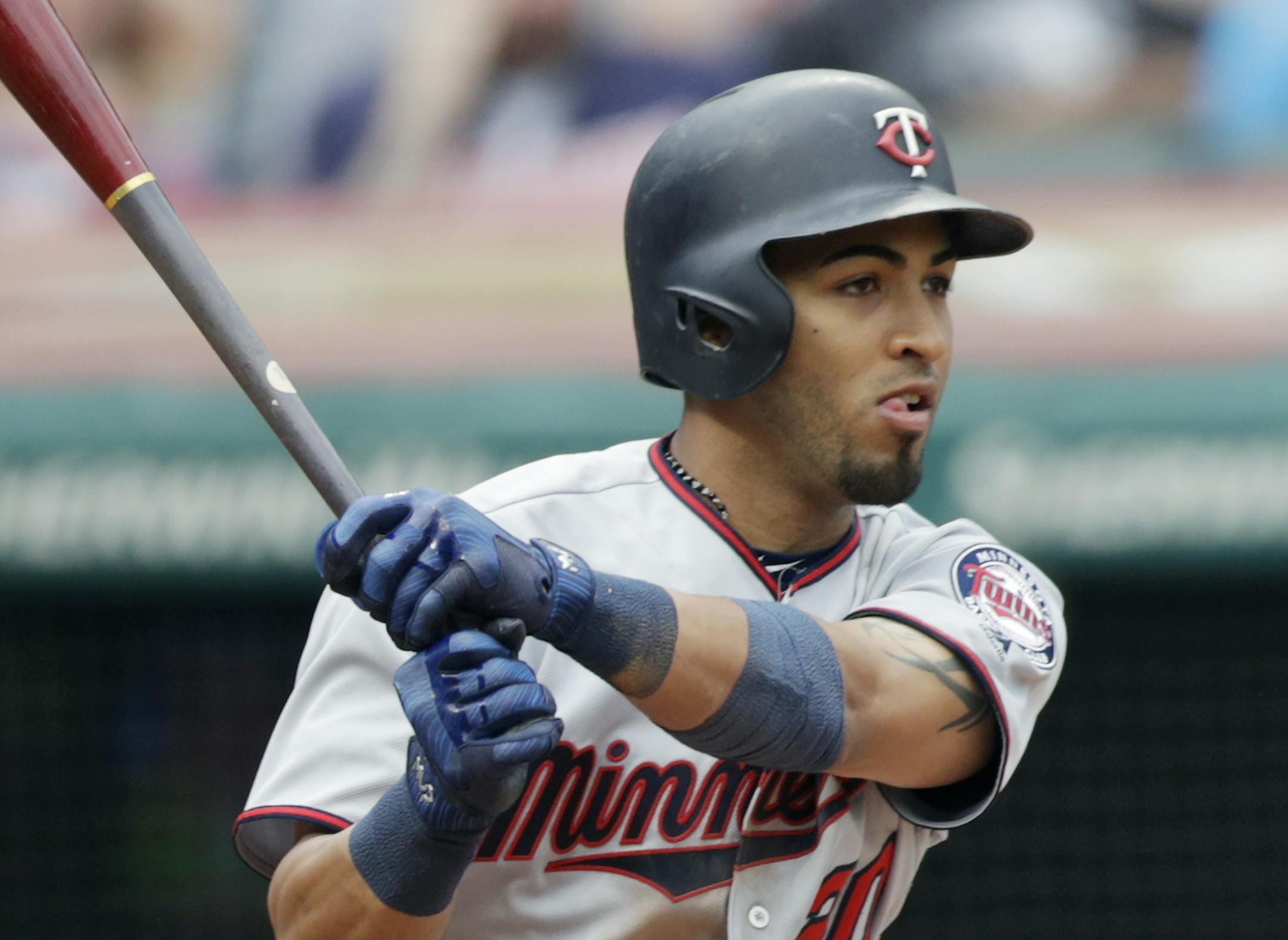 Minnesota Twins' Eddie Rosario hits an RBI-single off Cleveland Indians relief pitcher Tyler Olson in the sixth inning of a baseball game, Saturday, June 16, 2018, in Cleveland. Ehire Adrianza scored on the play. (AP Photo/Tony Dejak)