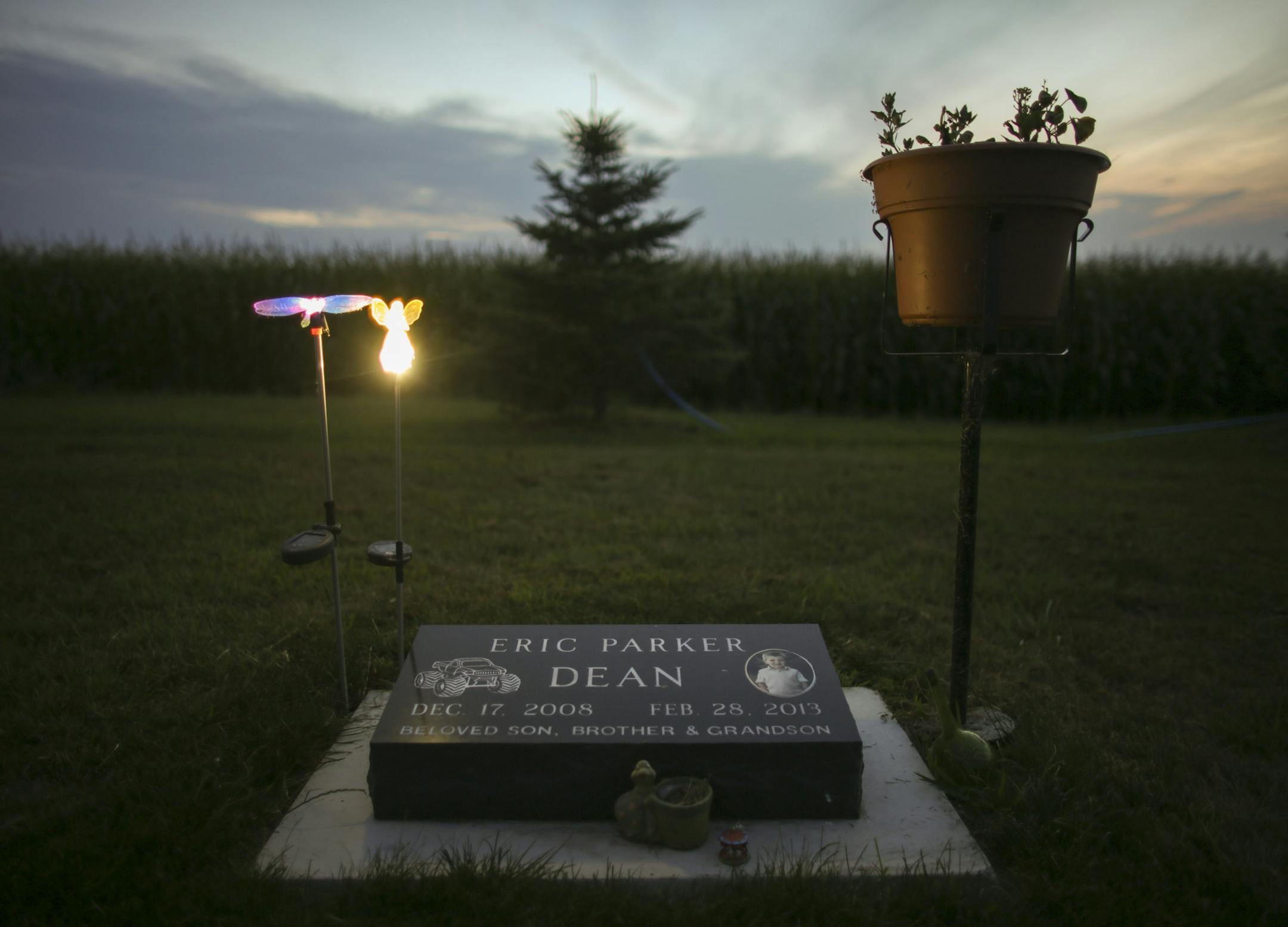 Solar powered ornaments glowed at dusk above Eric Dean's grave in the St. Paul's Lutheran Cemetery outside Lowry, MN last month. ] JEFF WHEELER &#x2022; jeff.wheeler@startribune.com Eric Dean's grave at the St. Paul's Lutheran Cemetery in Lowry, MN on Tuesday evening, July 15, 2014.