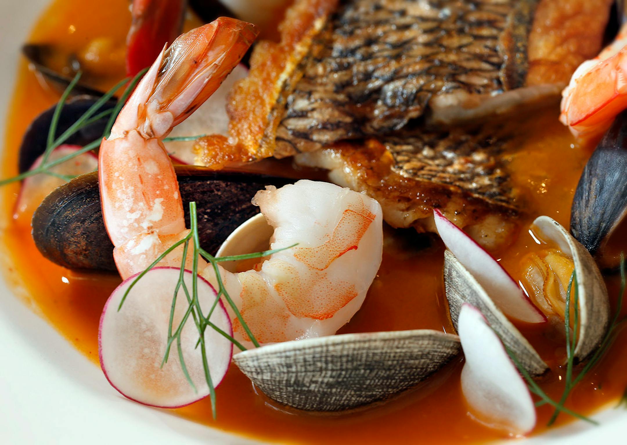 Bouillabaise, dish of Bellecour, sea bass, shrimp, clams, baguette, rouille.
