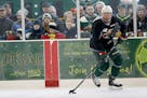 Fans watched Minnesota Wild player Matt Dumba practice during an open outdoor Wild practice at the Backyard Outdoor Ice Rink at Braemar Arena, Monday,