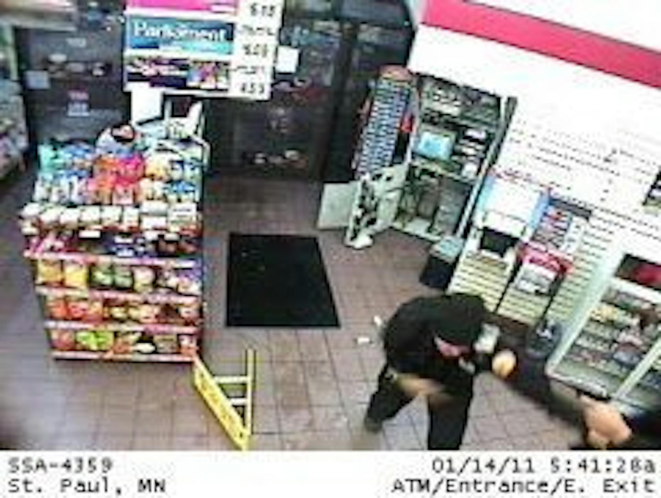 In this screen grab from surveillance, an armored truck guard is seen being attacked for by a gunman in a Super America in St. Paul on Jan. 14, 2011.