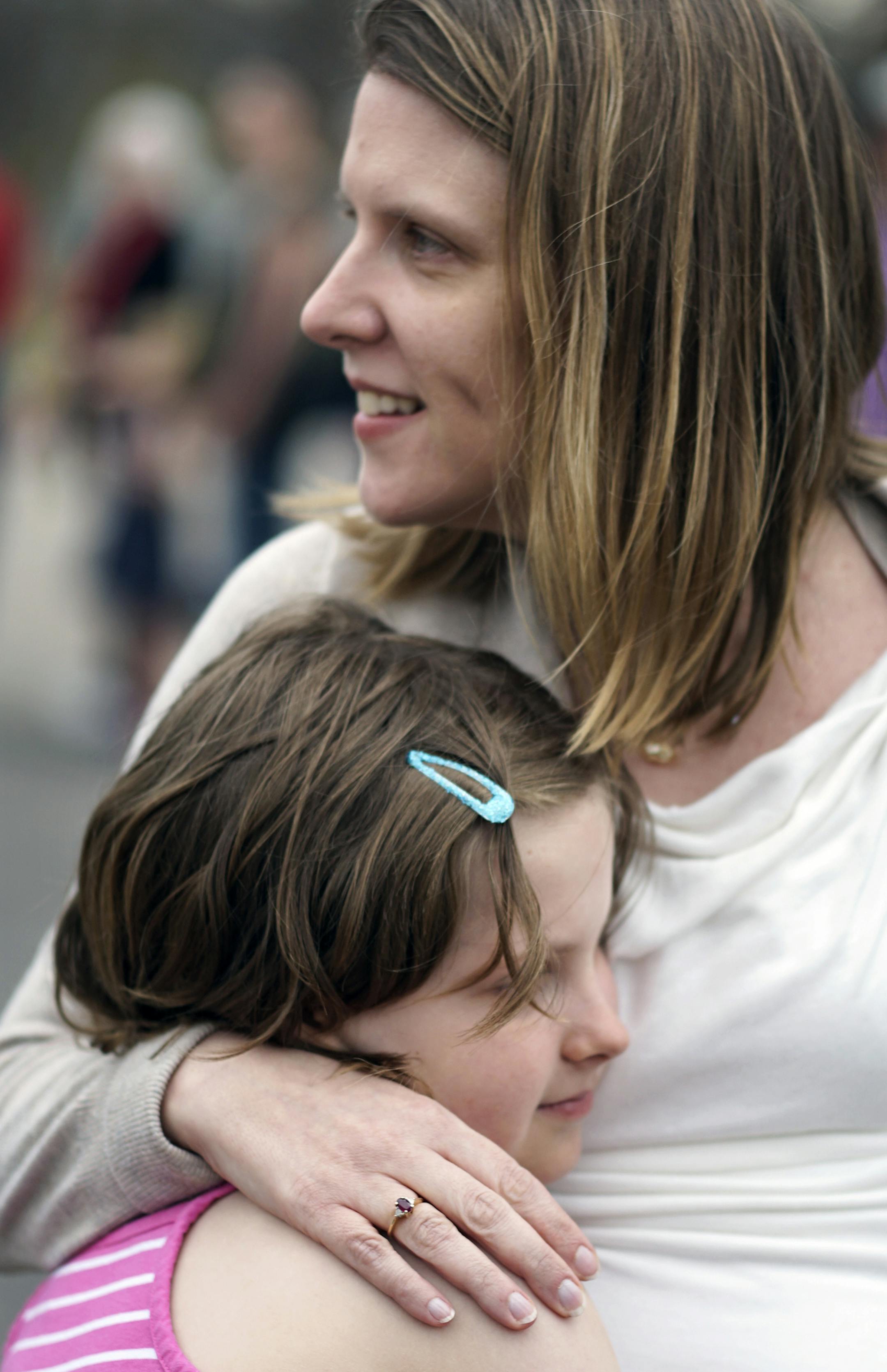 At Silverwood Park in St. Anthony Main on National High Five Day, Molly Vergin,8, hugged her mother Stephanie.] Richard Tsong-Taatarii/rtsong-taatarii@startribune.com