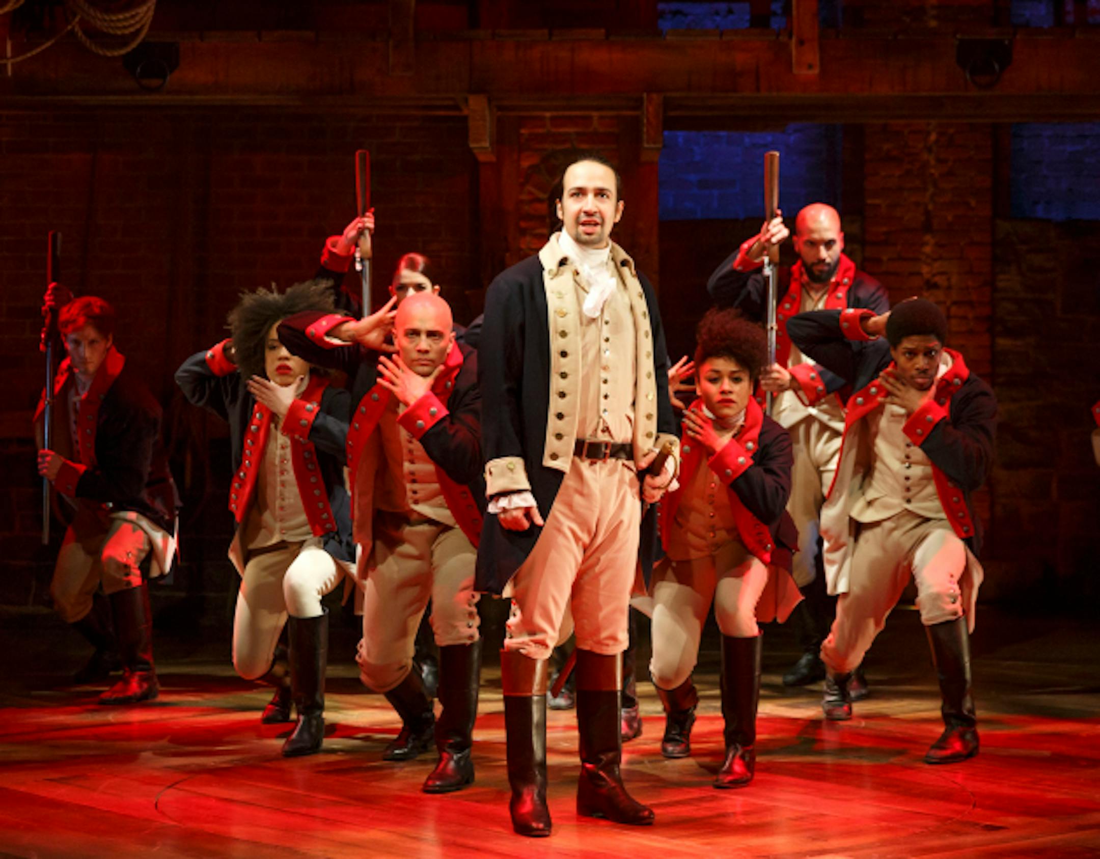 This image released by The Public Theater shows Lin-Manuel Miranda, foreground, with the cast during a performance of "Hamilton," in New York. (Joan Marcus/The Public Theater via AP)