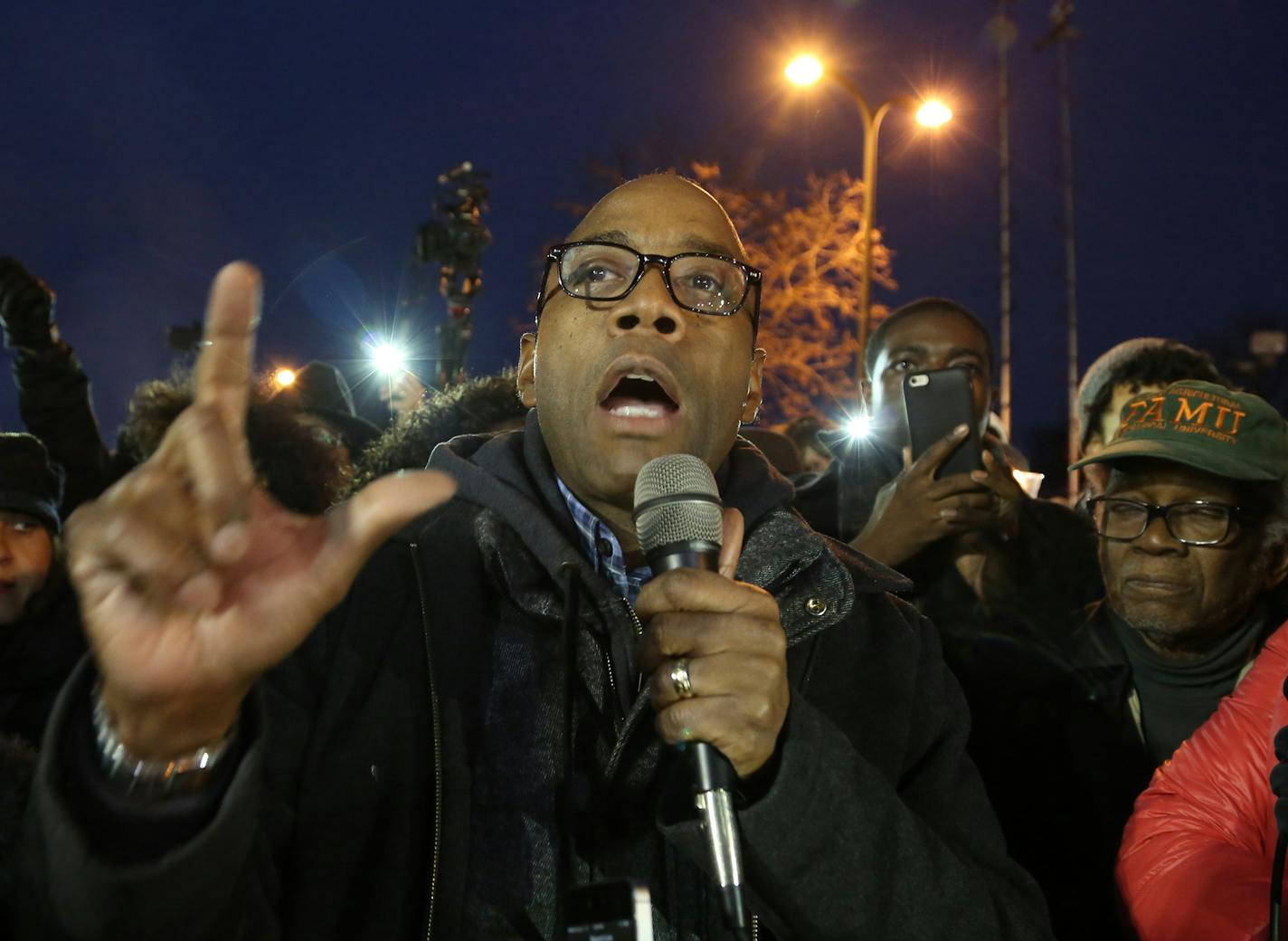 The president of the NAACP Cornell Brooks spoke during a vigil held in front of the Minneapolis Fourth Precinct. ] (KYNDELL HARKNESS/STAR TRIBUNE) kyndell.harkness@startribune.com Protesters in front of Minneapolis Fourth Precinct in Minneapolis Min., Friday November 20, 2015. ORG XMIT: MIN1511202007500239