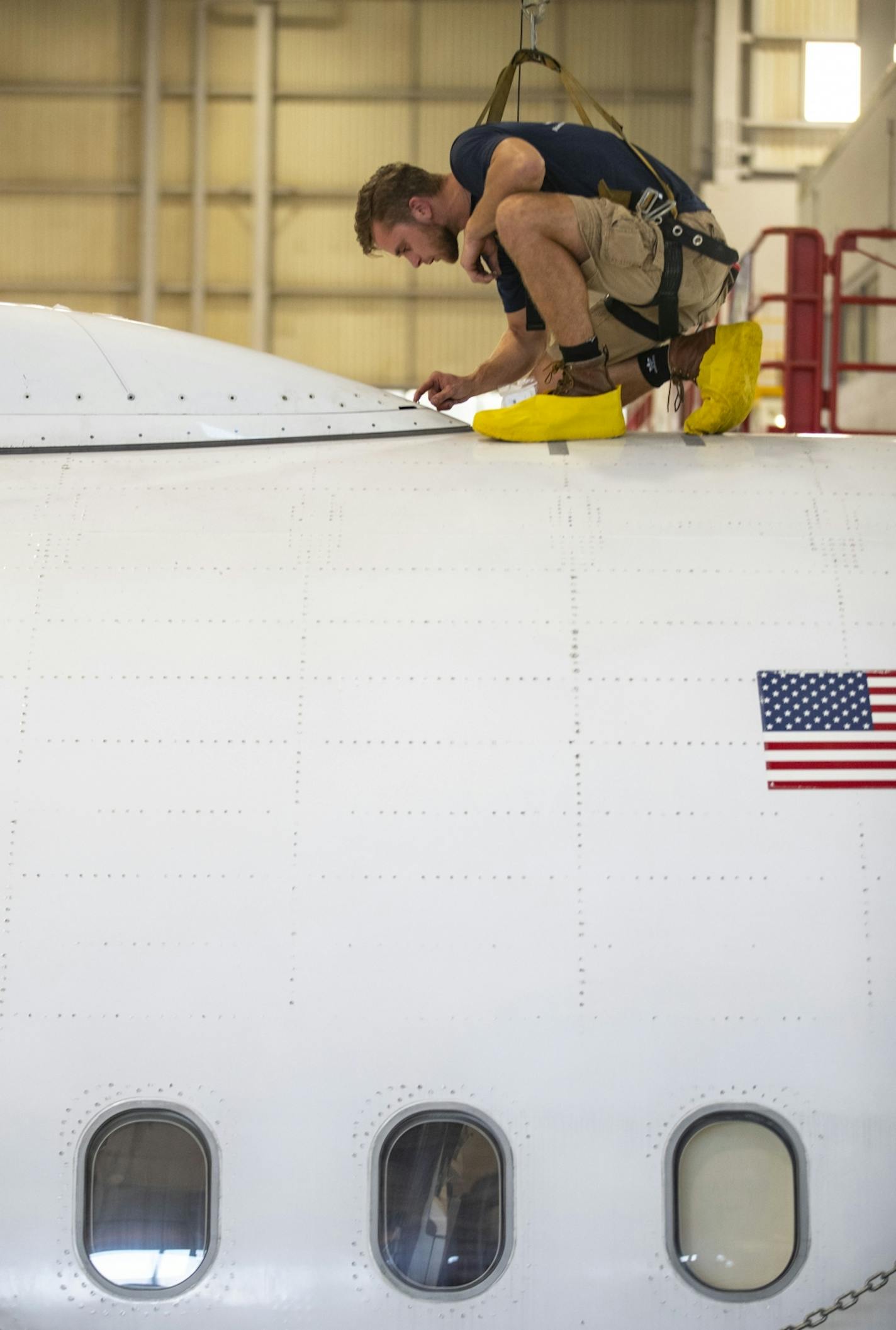 Kieran Cummings worked to attach a GCS Radome with special screws on top of a commercial airplane on Tuesday September 17, 2019.