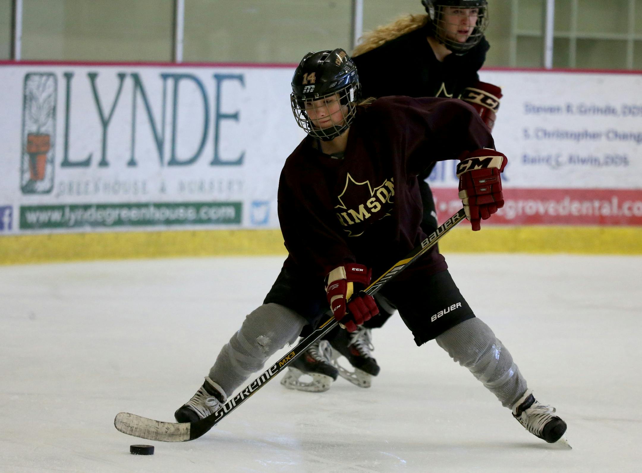 Maple Grove's Lauren Kaufman settled the puck before passing as they went through drills during practice. ] (KYNDELL HARKNESS/STAR TRIBUNE) kyndell.harkness@startribune.com During the girls Maple Grove hockey team practice at Maple Grove Ice Arena in Maple Grove Min., Tuesday November 3, 2015.