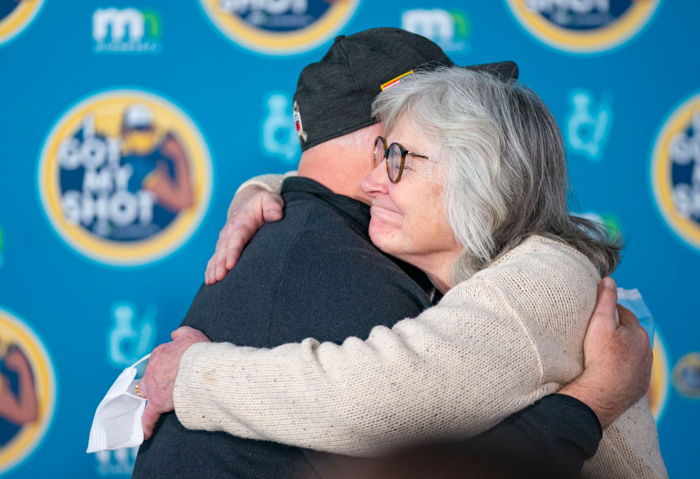 Minnesota Gov. Tim Walz hugged Department of Health Commissioner Jan Malcolm after a news conference Friday at the Minnesota Department of Health Community Vaccination Program Site at the Mall of America. The site closed for good Friday night.