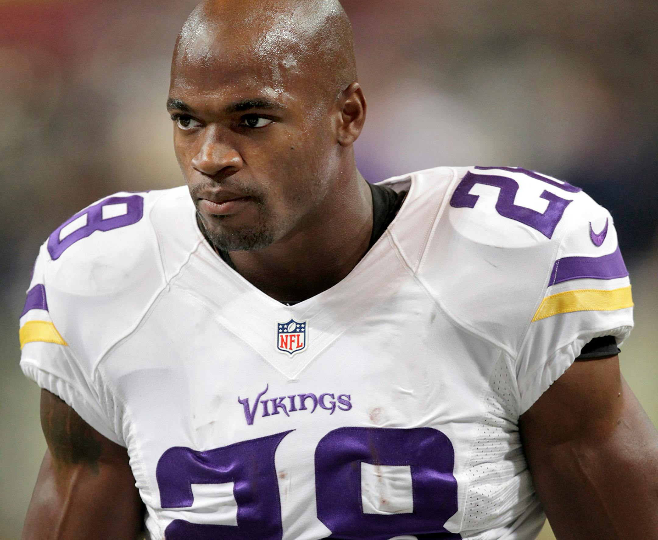 Minnesota Vikings running back Adrian Peterson warms up before the start of an NFL football game between the St. Louis Rams and the Minnesota Vikings Sunday, Sept. 7, 2014, in St. Louis. (AP Photo/Tom Gannam)