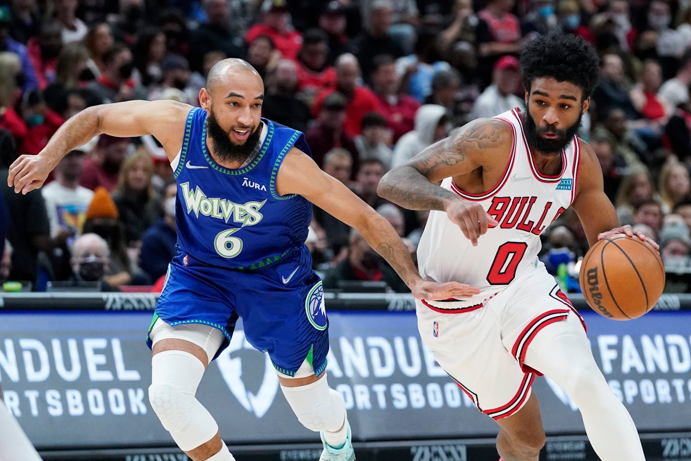 Bulls guard Coby White drives as Timberwolves guard Jordan McLaughlin guards Feb. 11,