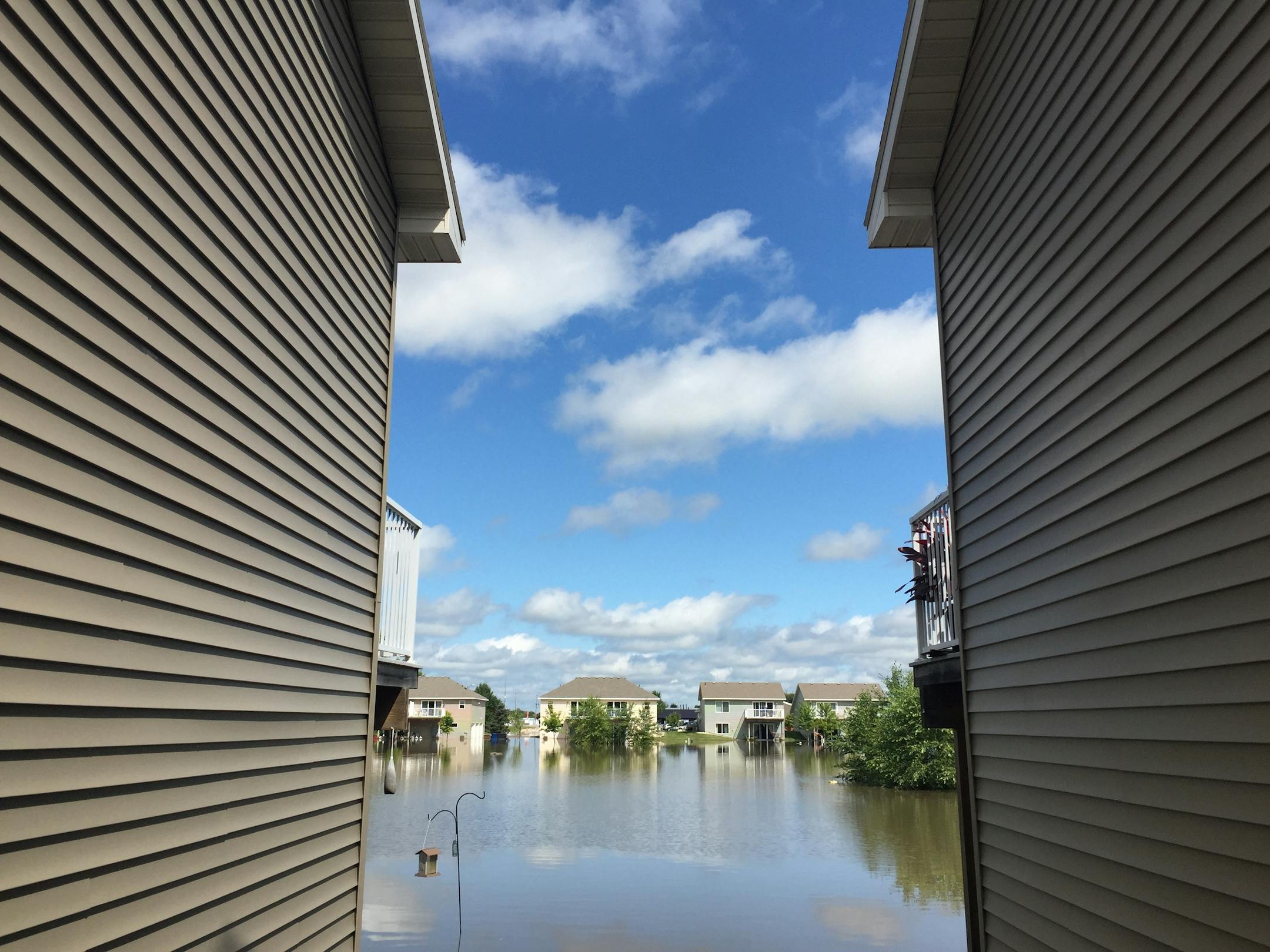 A park area surrounded by houses on 2nd Av. S.E. in Willmar is still flooded Thursday after the area received more than 13 inches of rain in 24 hours overnight.