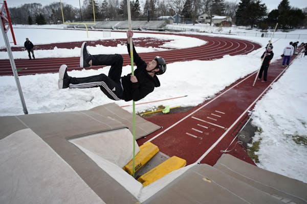 Pole vaulter Sam Adair of White Bear Lake's track and field team takes to the air Wednesday on the first day the team has been able to practice outsid