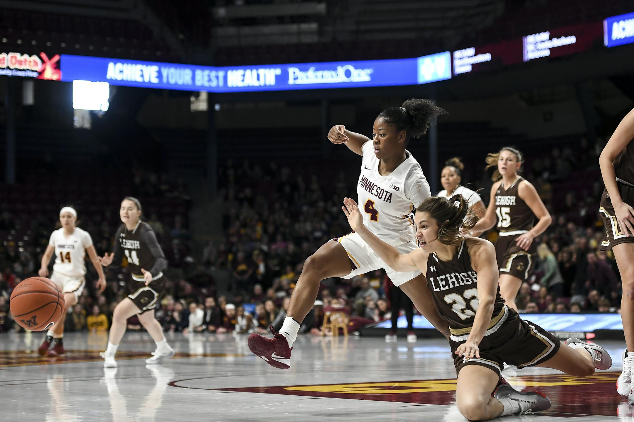 Lehigh Mountain Hawks guard Hannah Hedstrom (22) fell to the floor as she battled for a rebound with Minnesota Gophers guard Jasmine Powell (4) in the first half.