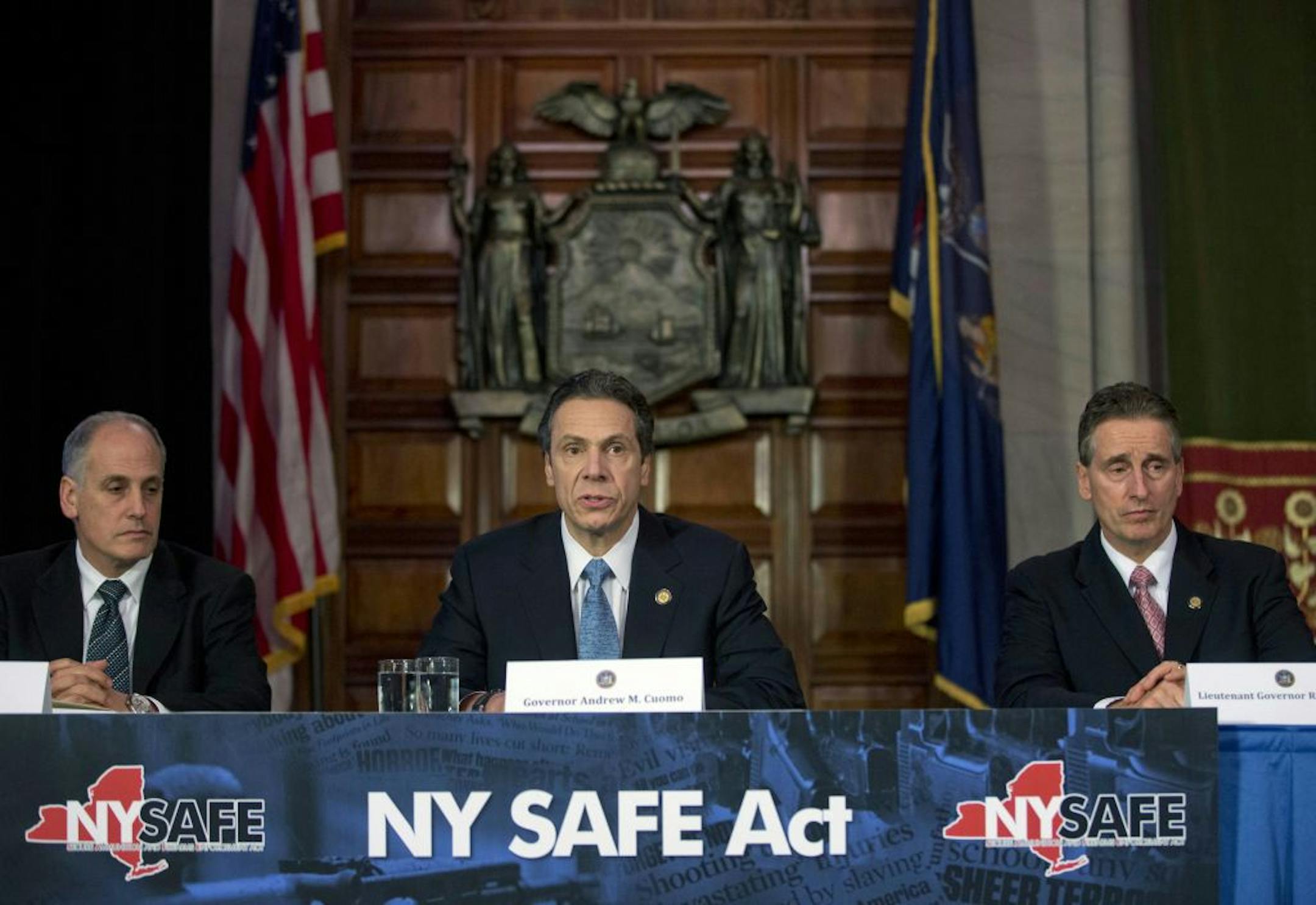 New York Gov. Andrew Cuomo, center, speaks during a news conference announcing an agreement with legislative leaders on New York's Secure Ammunition and Firearms Enforcement Act on Monday, Jan. 14, 2013, in Albany, N.Y. Also pictured are Secretary to the Governor Larry Schwartz, left, and Lt. Gov. Robert Duffy.