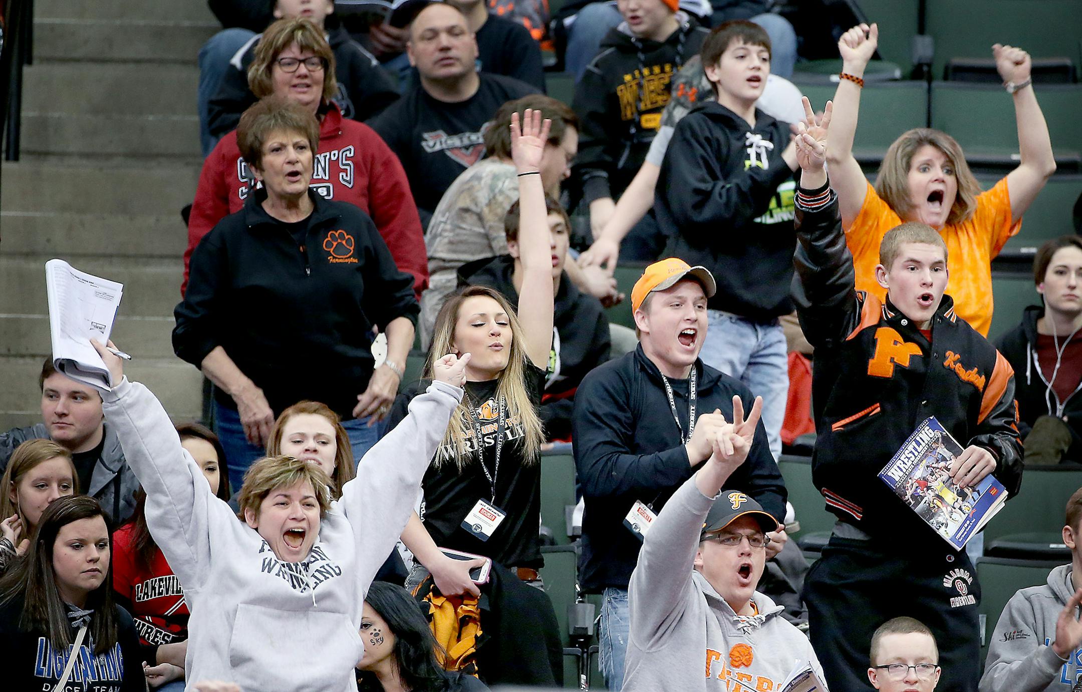Wrestling fans cheered on their wrestlers during the Minnesota State High School League Wrestling State Tournament, Friday, February 27, 2015 at the Xcel Energy Center in St. Paul, MN. ] (ELIZABETH FLORES/STAR TRIBUNE) ELIZABETH FLORES • eflores@startribune.com