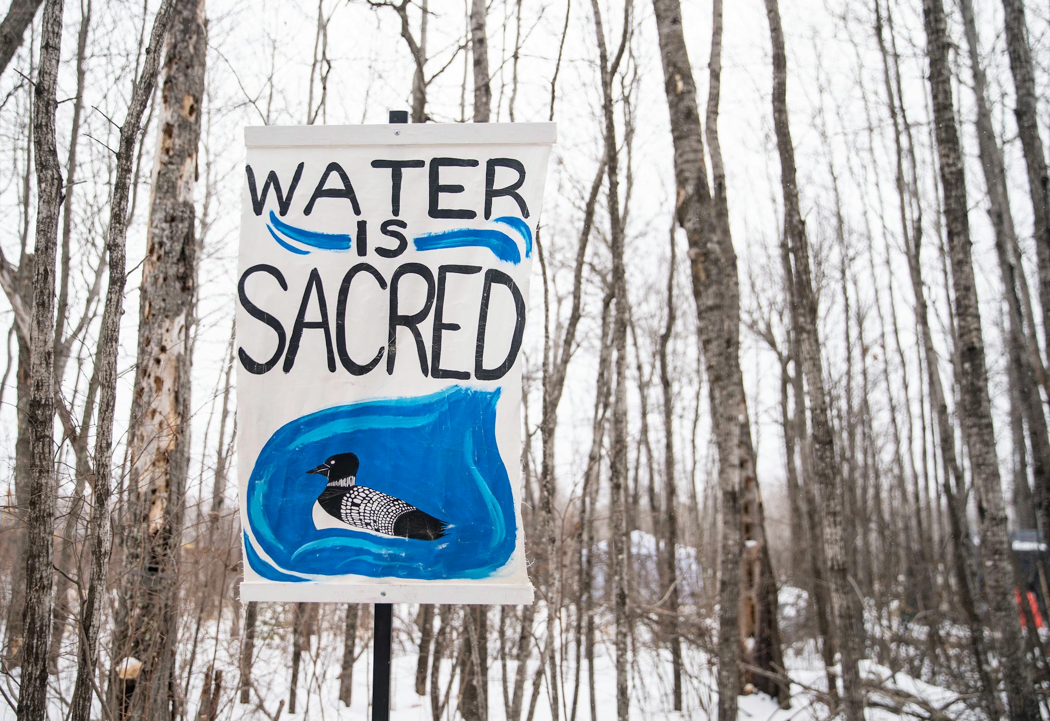 Signs are posted outside Camp Migizi, a small encampment of mostly indigenous water and land protectors located right beside the Enbridge Line 3 construction site on the Fond Du Lac Native American reservation in Cloquet.