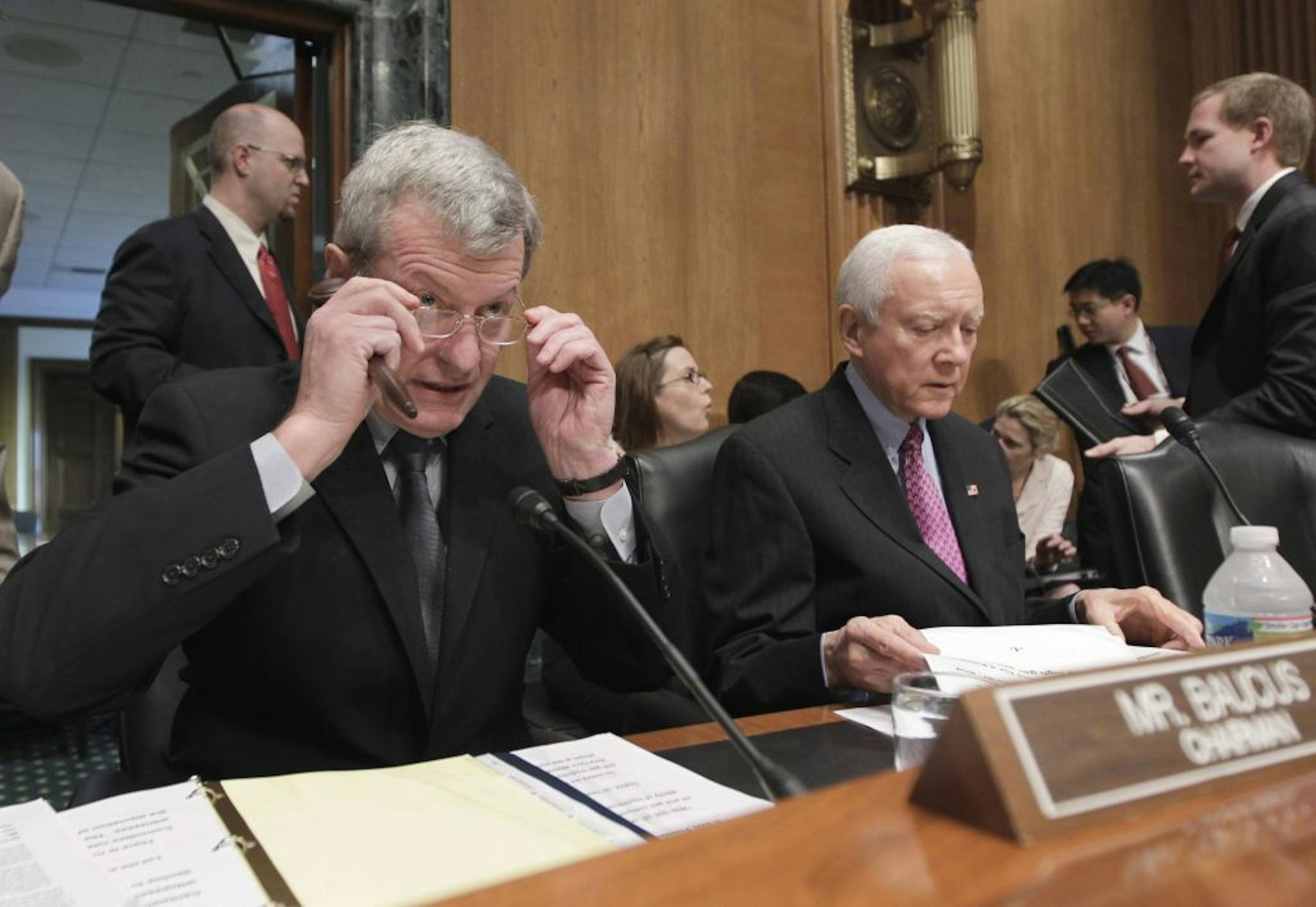FILE - In this May 12, 2011 file photo, Senate Finance Committee Chairman Sen. Max Baucus, D-Mont., left, and and the committee's ranking Republican Sen. Orrin G. Hatch, R-Utah, right, open a hearing on Capitol Hill in Washington. The Obama administration has embarked on an aggressive trade agenda that could lower trade barriers and increase exports to many of the economic giants of Asia and Europe. To make that a reality, though, it may first have to negotiate future trade policy a little close