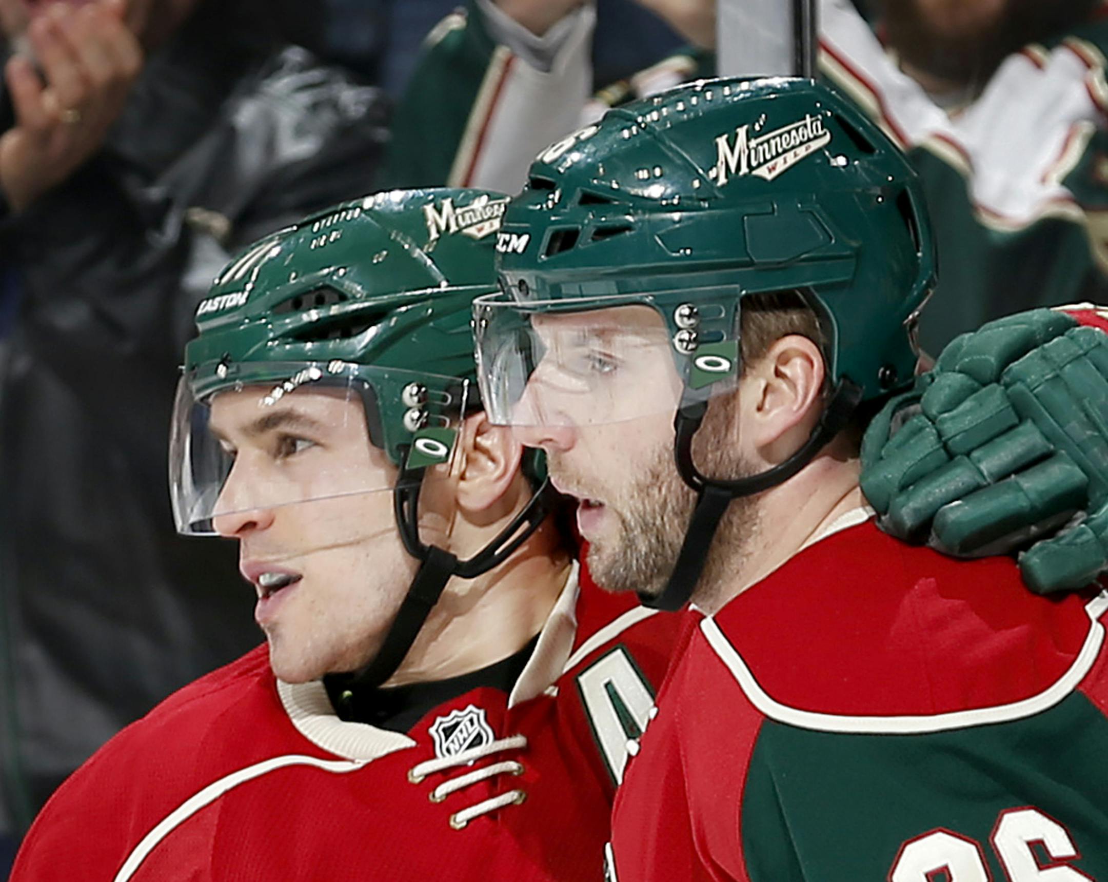 Zach Parise (11) celebrated with Thomas Vanek (26) after Parise scored a goal in the first period. ] CARLOS GONZALEZ cgonzalez@startribune.com, January 19, 2015, St. Paul, Minn., Xcel Energy Center, NHL, Minnesota Wild vs. Columbus Blue Jackets