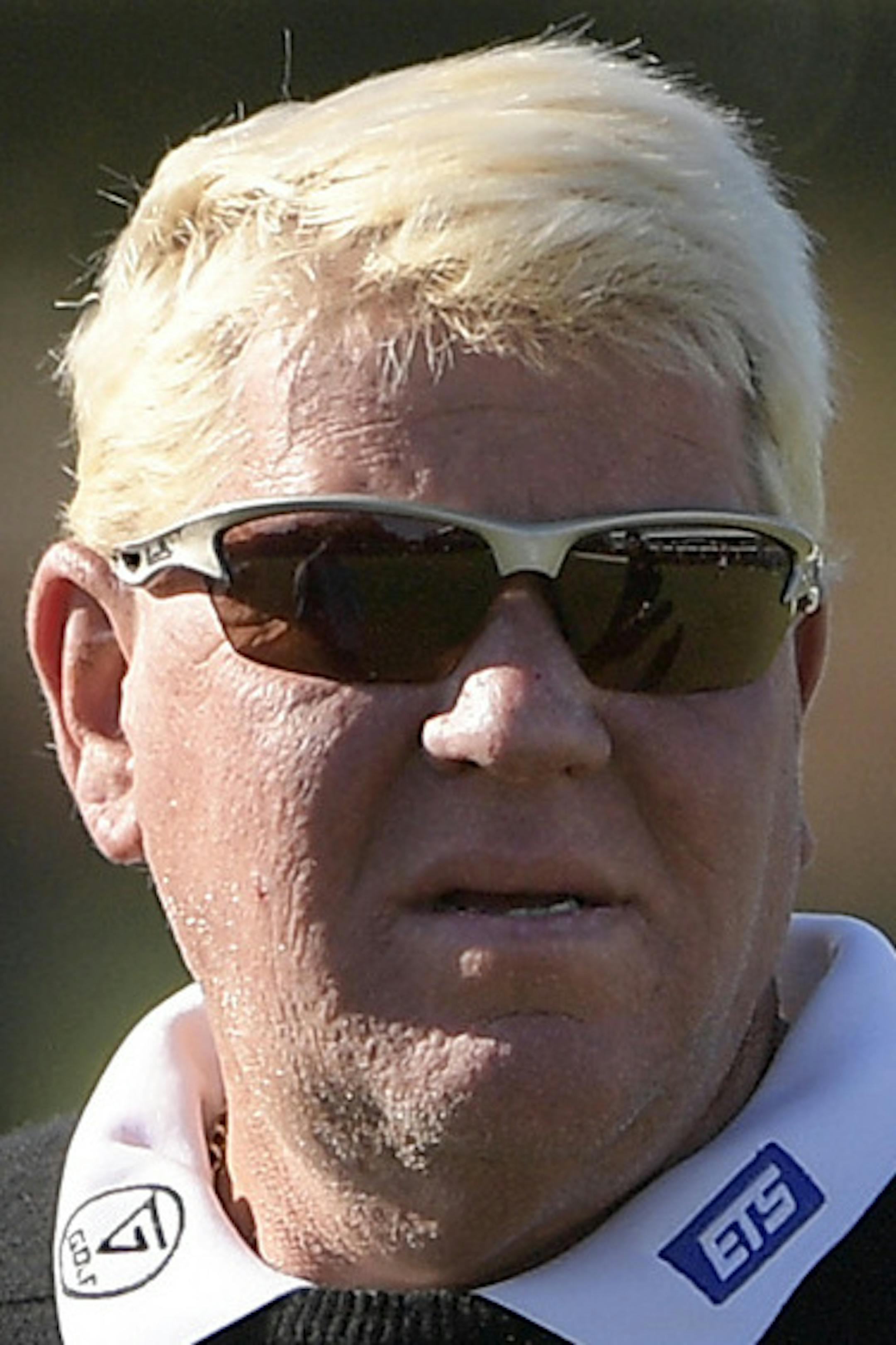 John Daly, left, talks with Ian Poulter, of England, on the 17th green during the first round of the Arnold Palmer Invitational golf tournament in Orlando, Fla., Thursday, March 16, 2017. (AP Photo/Phelan M. Ebenhack) ORG XMIT: OTKBH108