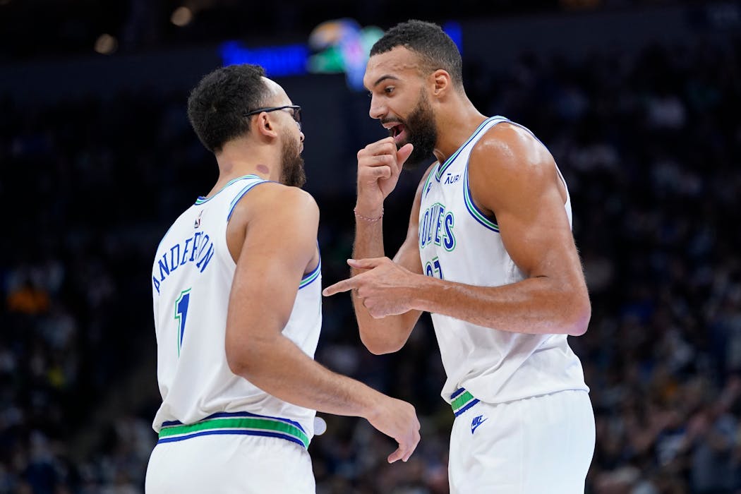 Wolves center Rudy Gobert, right, and forward Kyle Anderson talk during the first half Wednesday night. Gobert had 17 points and 21 rebounds.