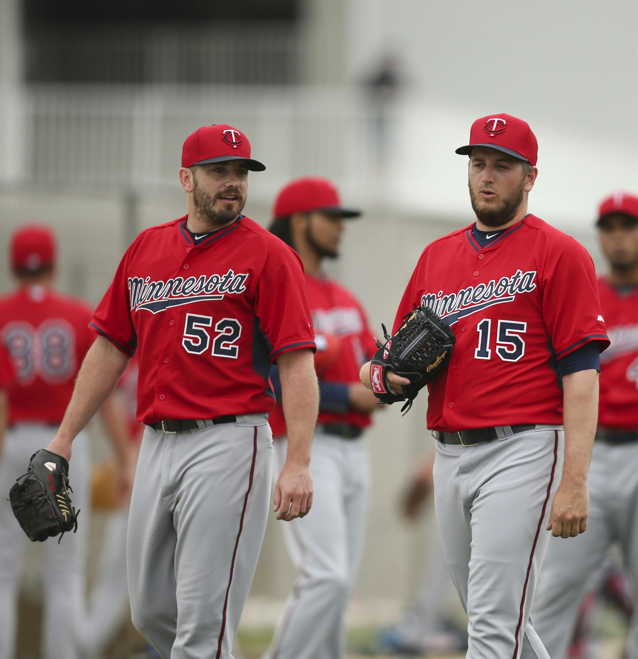 Twins pitchers Brian Duensing (52) and Glen Perkins (15) walked to the bullpen after stretching last Wednesday morning at Hammond Stadium. ] JEFF WHEELER &#xef; jeff.wheeler@startribune.com Twins pitchers and catchers continued their workouts Wednesday morning, February 25, 2015 at Hammond Stadium in Fort Myers, FL. ORG XMIT: MIN1503031723590529