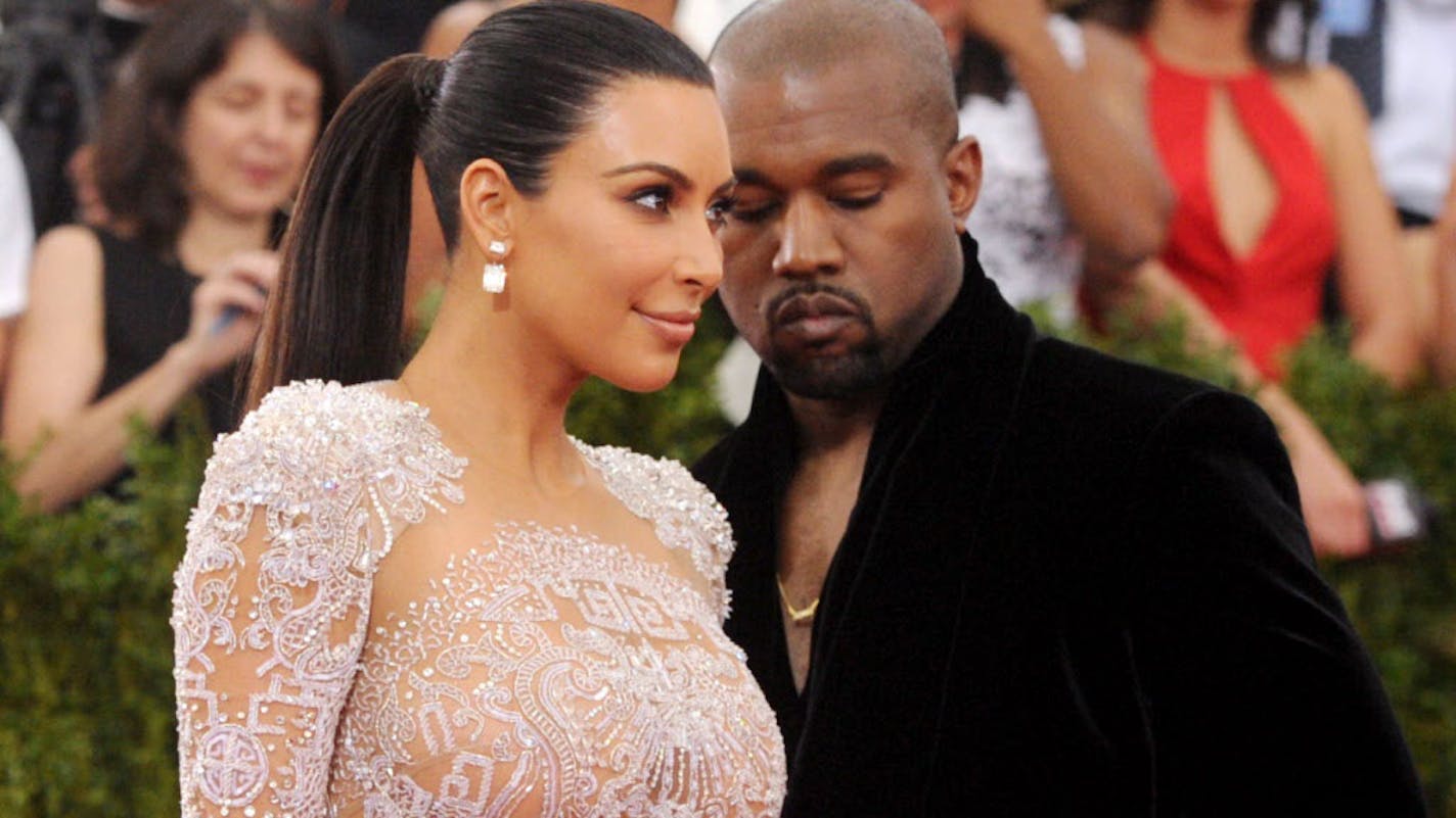 File-This May 4, 2015, file photo shows Kim Kardashian, left, and Kanye West arriving at The Metropolitan Museum of Art's Costume Institute benefit gala in New York. Kardashian says she is pregnant with her second child with West. She revealed the news in a clip that appeared after the Sunday, May 31, 2015, episode of the E! reality show "Keeping Up With the Kardashians." (Photo by Charles Sykes/Invision/AP, File)