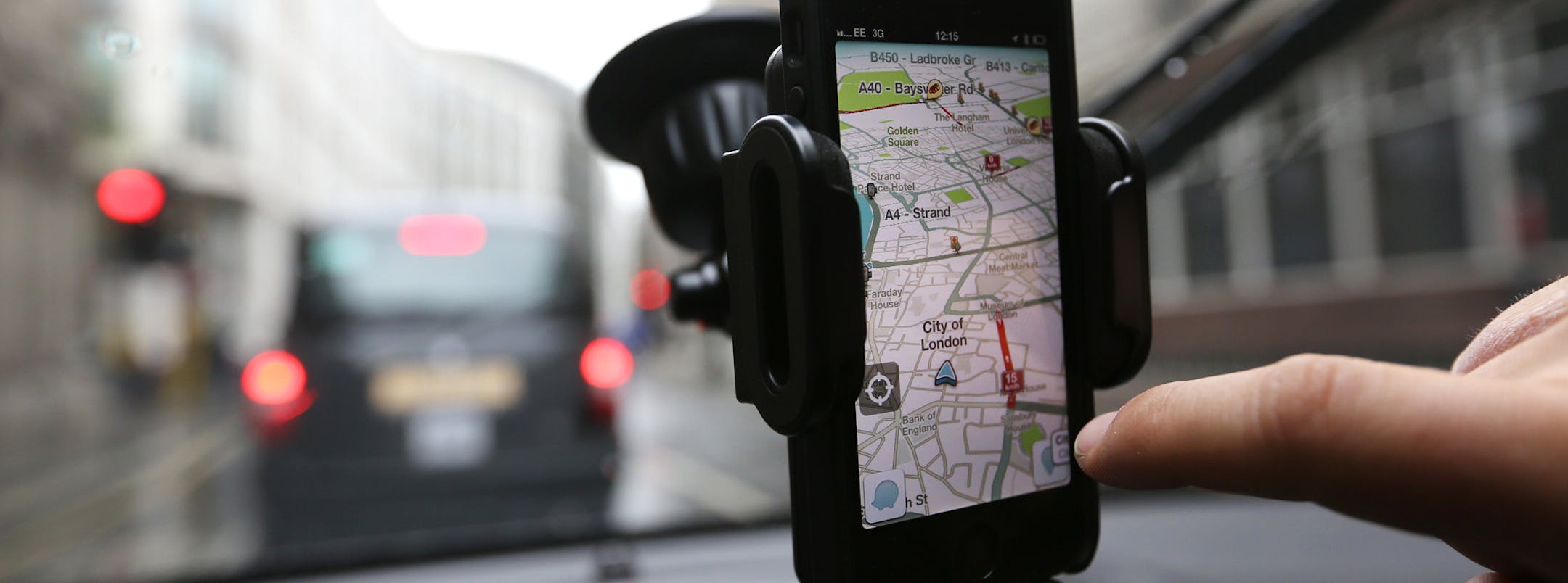 Waze's map-software, displayed on an iPhone in this arranged photograph in London. More people are using smartphones, and the free map apps available on them, for their drives, threatening automakersí pricey and profitable in-car navigation systems.Illustrates AUTOS-APPS (category f) by Keith Naughton © 2013, Bloomberg News. Moved Thursday, July 11, 2013. (MUST CREDIT: Bloomberg News photo by Chris Ratcliffe).
