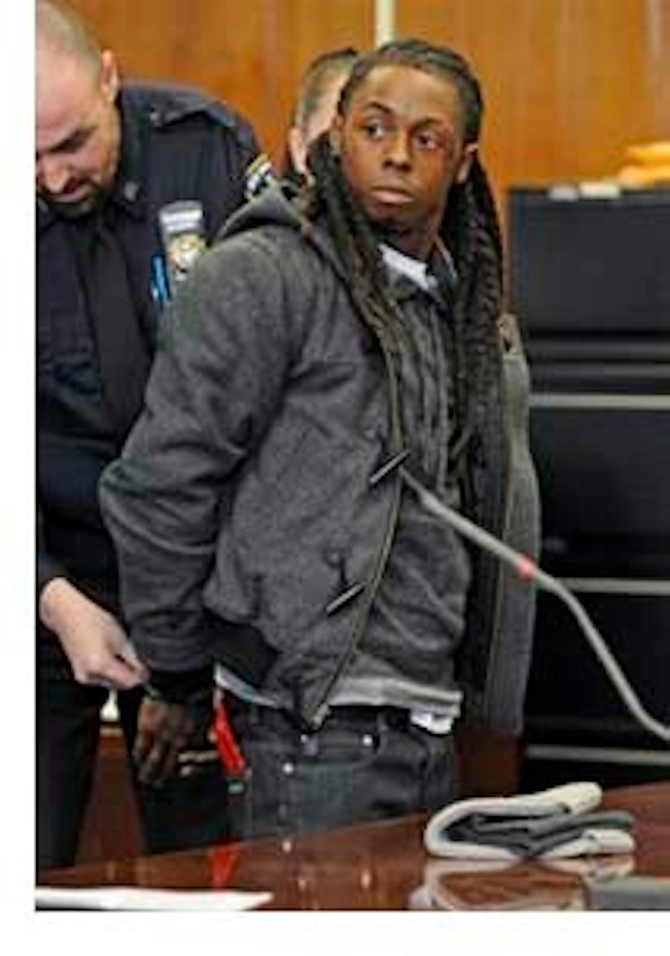 Lil Wayne, dressed for success at a court appearance (AP photo)