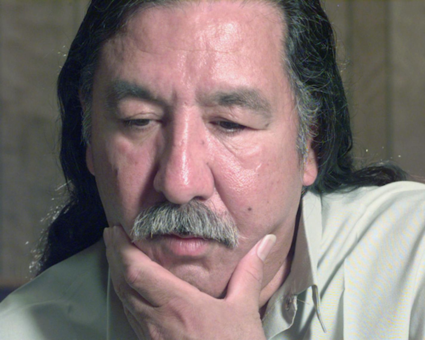 FILE - In this April 29, 1999, file photo, American Indian activist Leonard Peltier speaks during an interview at the U.S. Penitentiary at Leavenworth, Kan. President Barack Obama has denied a clemency request by Peltier, who has spent most of his life in prison in the killing of two FBI agents in South Dakota in 1975. Peltier's attorney, Martin Garbus, says they received a letter from the White House on Wednesday Jan. 18, 2017 saying their application has been denied. (Joe Ledford/The Kansas City Star via AP, File)