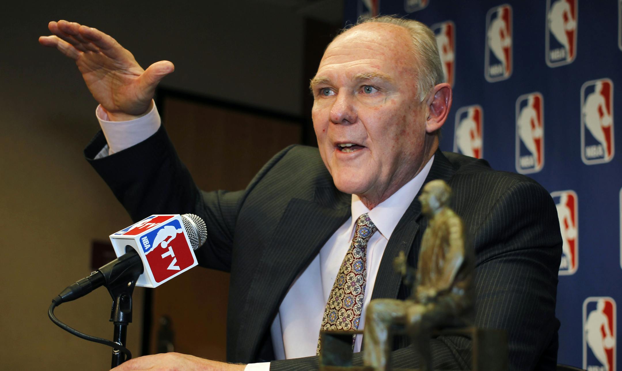 FILE - In this May 8, 2013 file photo, George Karl makes a point to reporters during a news conference where he was named the NBA Coach of the Year, in Denver.