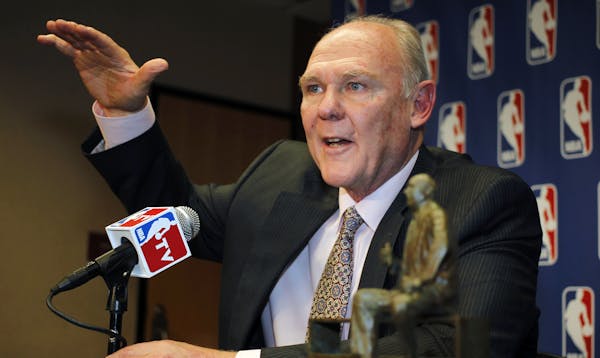 FILE - In this May 8, 2013 file photo, George Karl makes a point to reporters during a news conference where he was named the NBA Coach of the Year, i