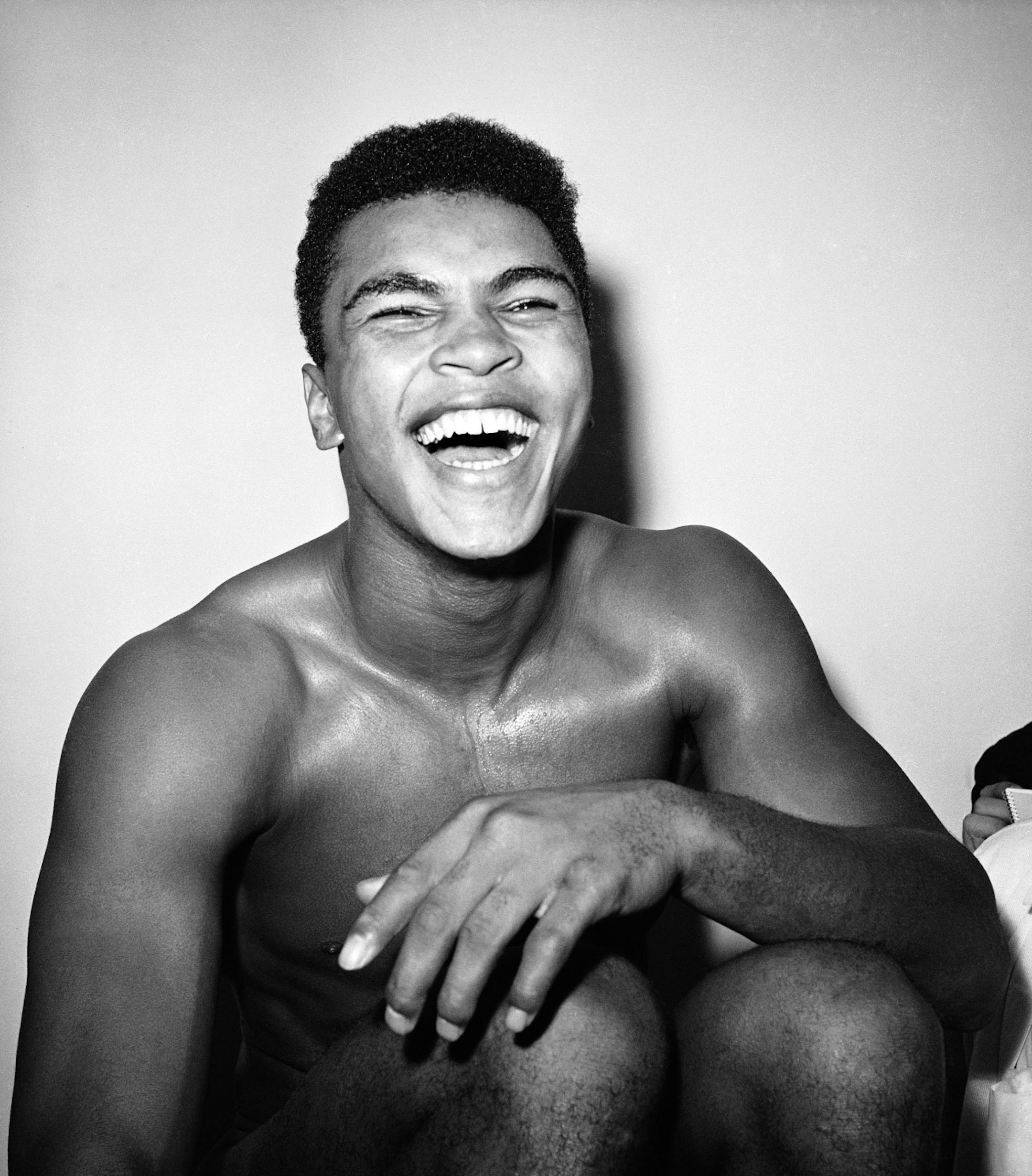 Cassius Clay is a happy young man in his dressing room after knocking out Archie Moore in the exact round he predicted he would, the fourth, at Los Angeles, Nov. 17, 1962. (AP Photo) ORG XMIT: APHS283241
