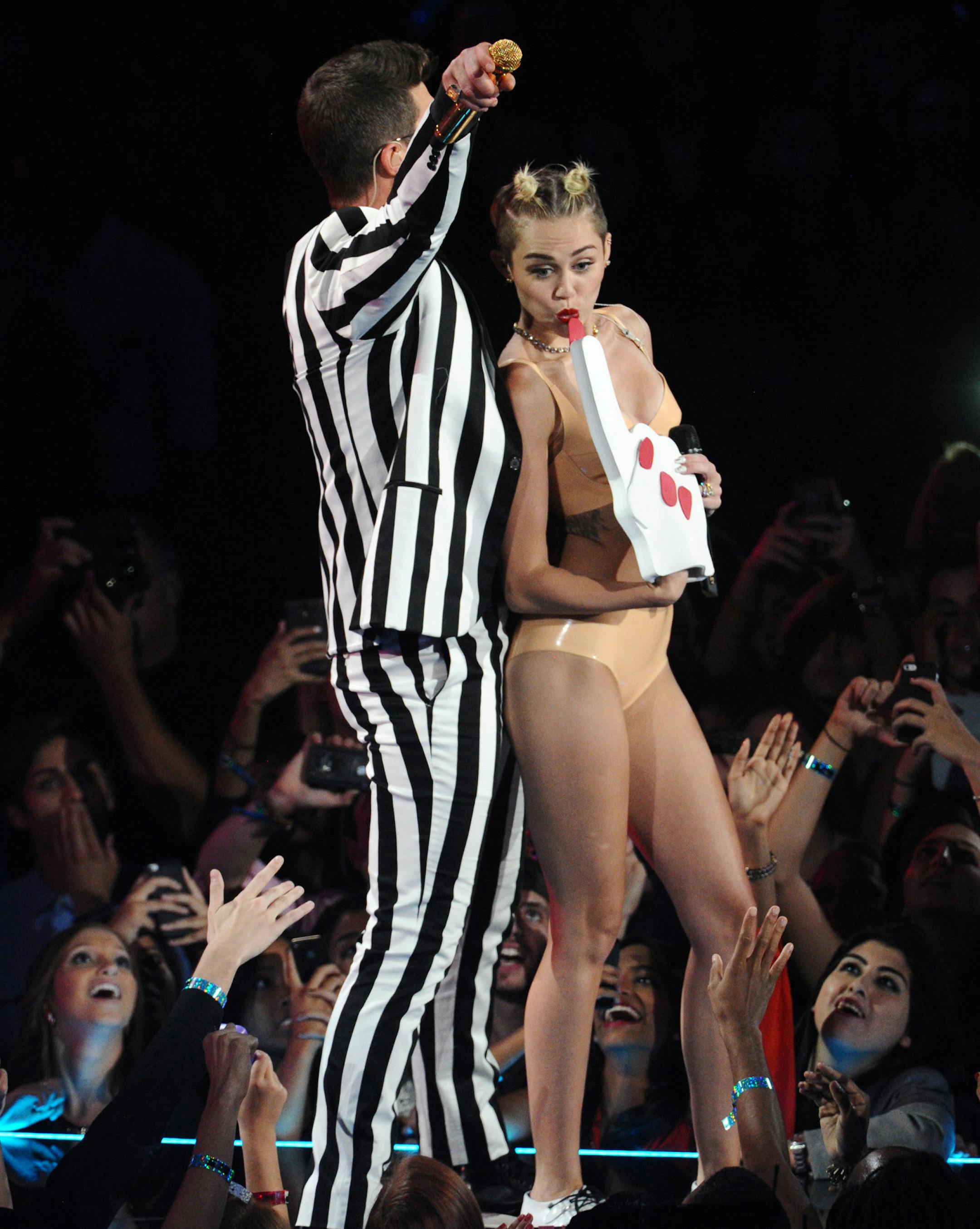 From left, Robin Thicke and Miley Cyrus perform "Blurred Lines" at the MTV Video Music Awards on Sunday, Aug. 25, 2013, at the Barclays Center in the Brooklyn borough of New York. (Photo by Charles Sykes/Invision/AP) ORG XMIT: INVW