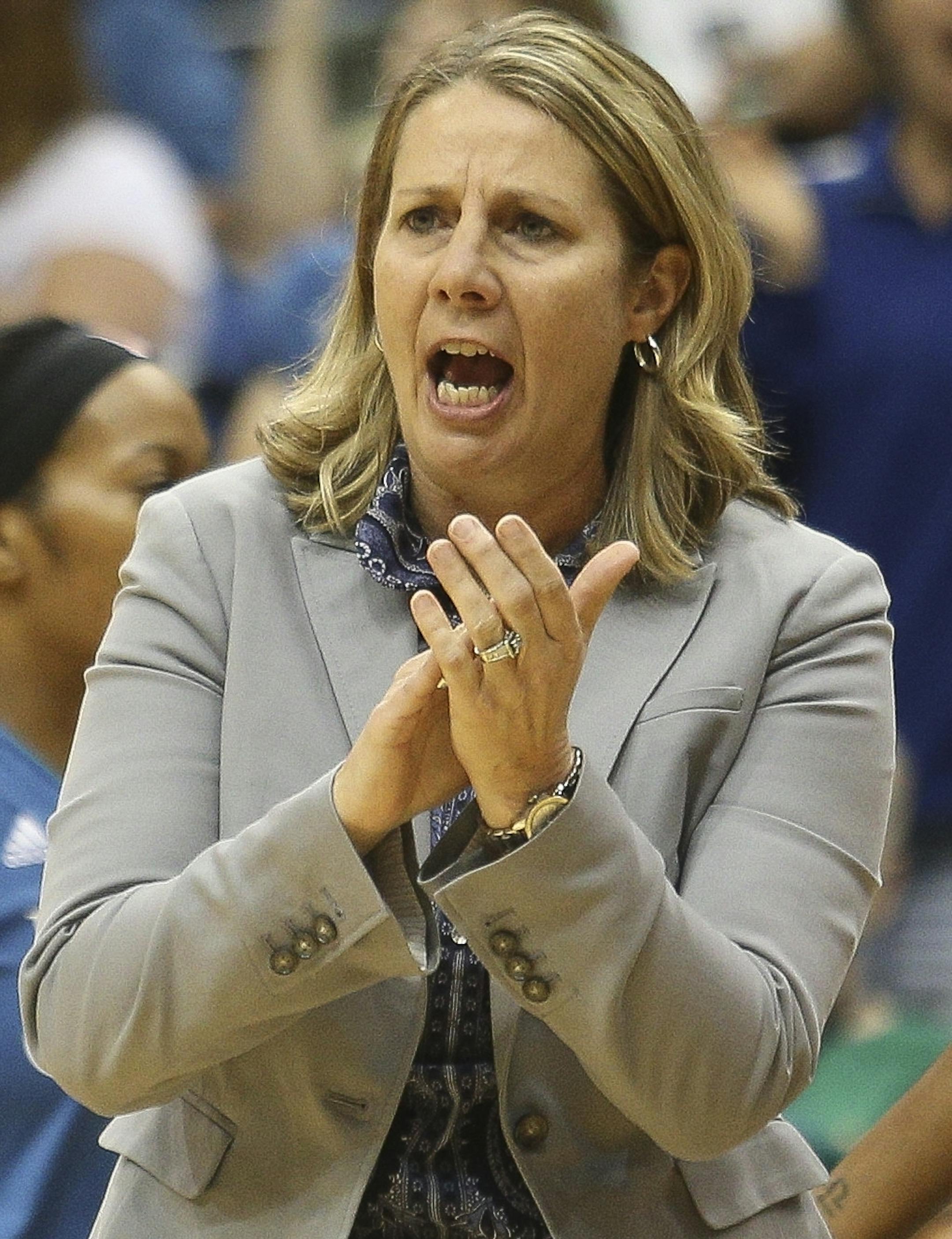 Minnesota Lynx head coach Cheryl Reeve encourages her players during the first quarter.