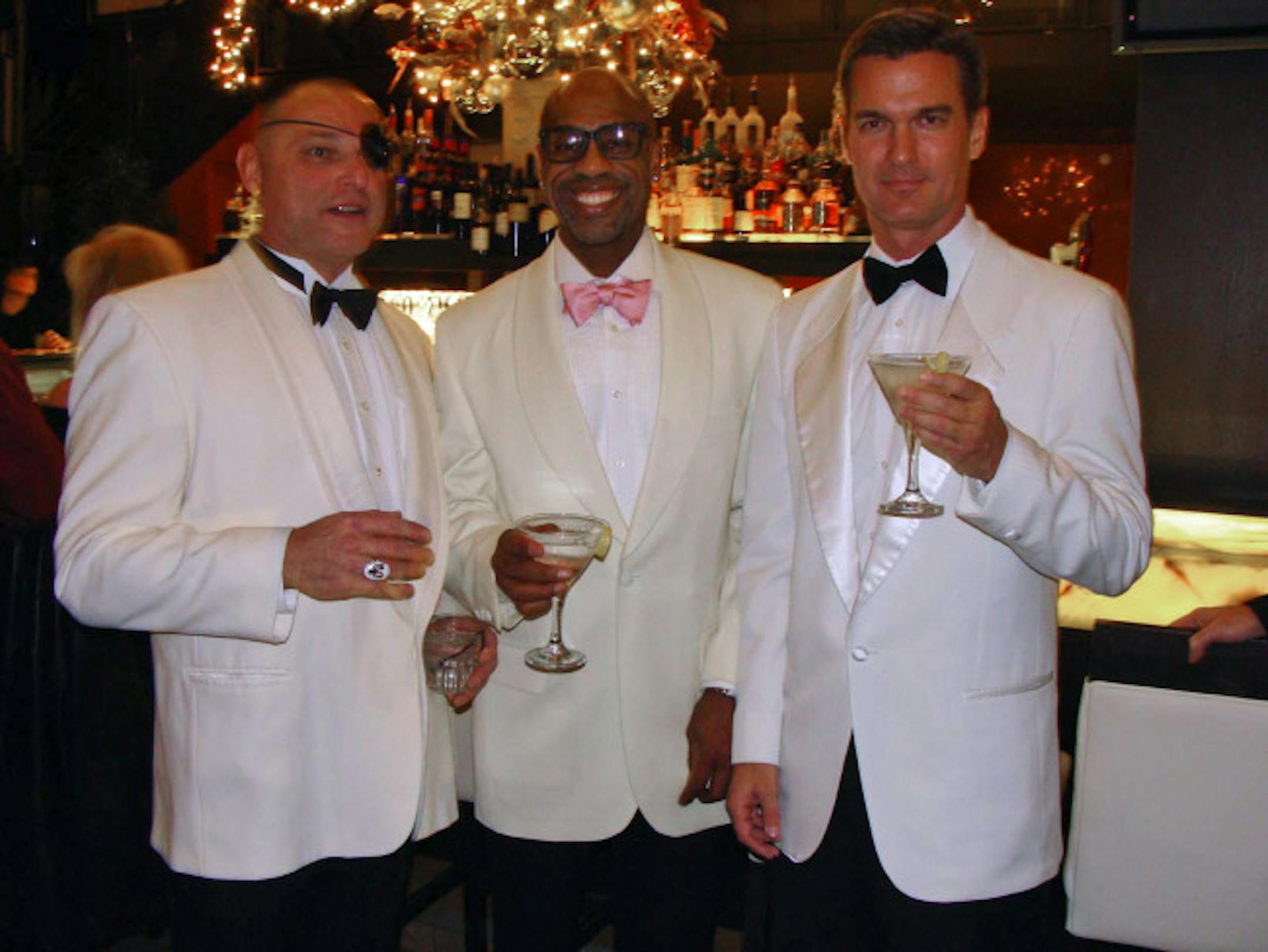 Two Bonds and a bad guy: Michael Delgado, associate publisher of Metro, as villian Emilio Largo; Richard Moody (iammoody.com); Mike Jaszewski, graphic designer.